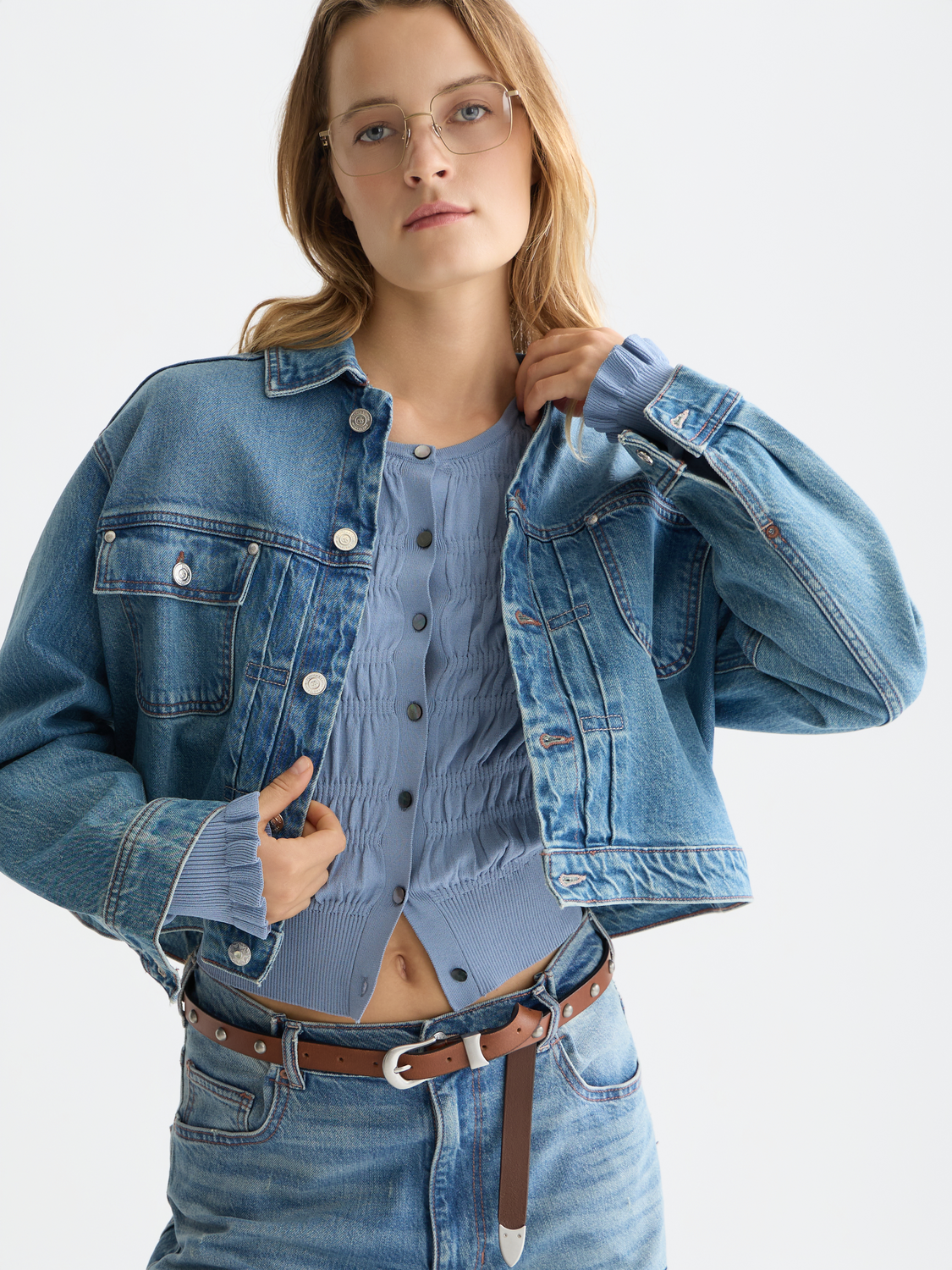 SCOTCH & SODA denim trucker jacket with classic fit, button closure, and chest pockets, shown on a model.