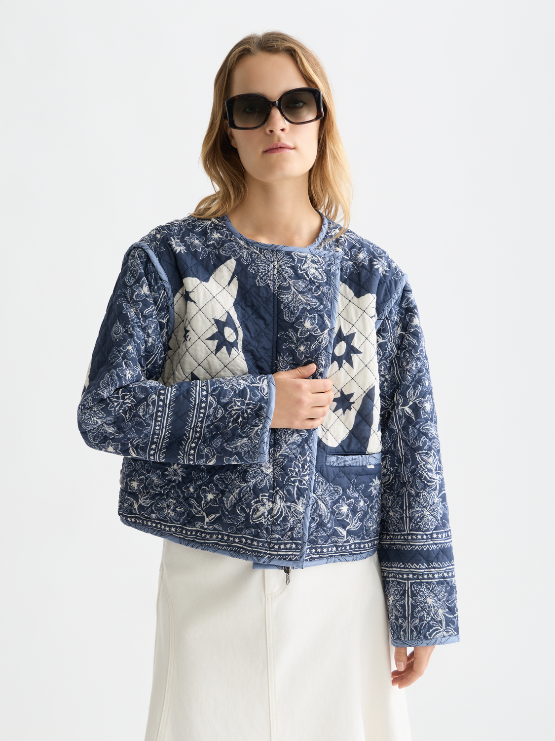 Reversible quilted bomber jacket by Scotch & Soda featuring a stylish design with quilted details and versatile wear options.