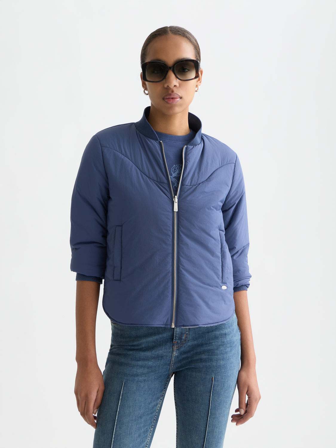 Reversible Scotch & Soda bomber jacket in dark and printed fabric, displayed on a model showing front view.