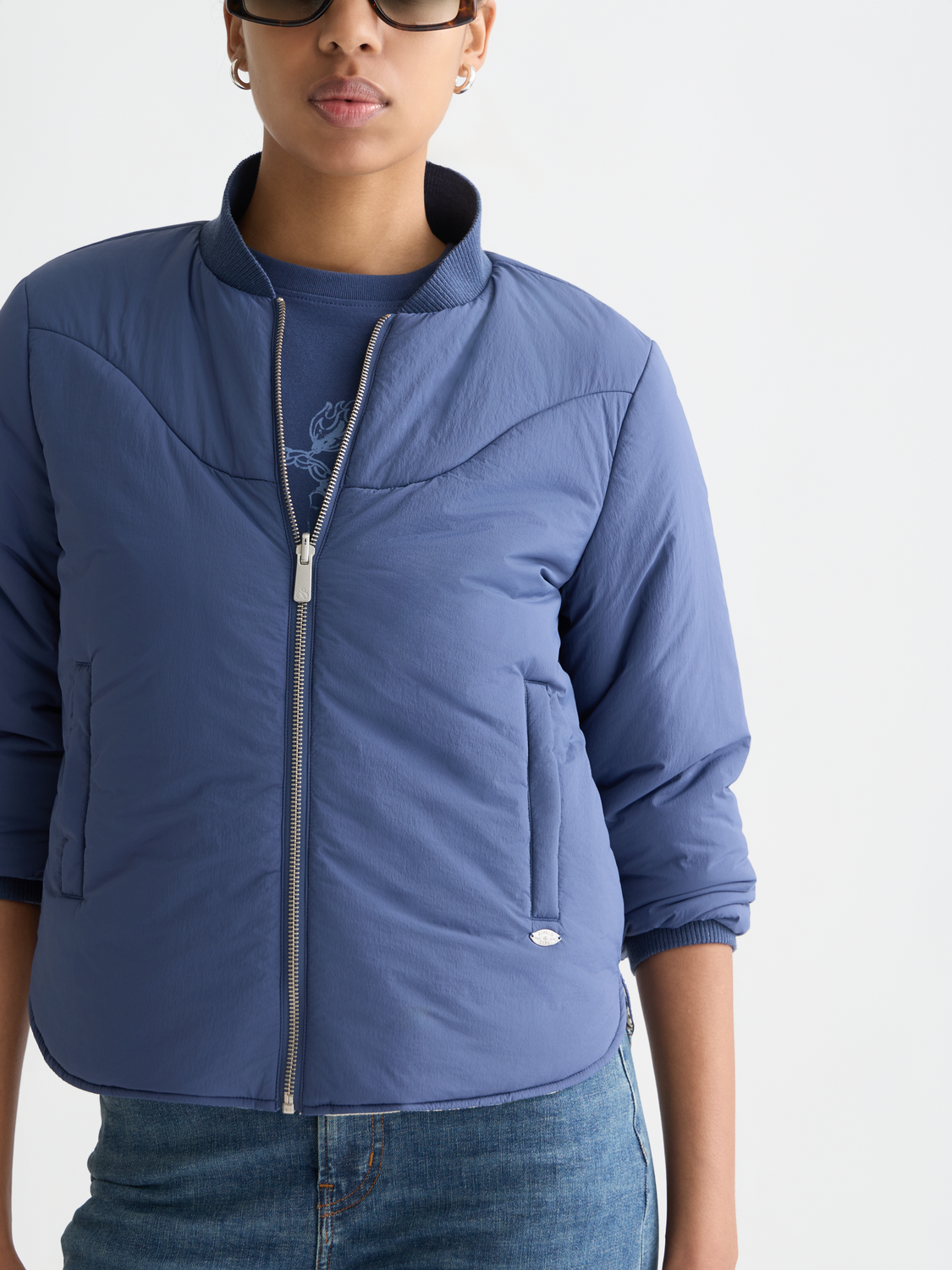 Reversible bomber jacket by Scotch & Soda, shown with one side featuring a classic design and the other side in contrasting fabric.