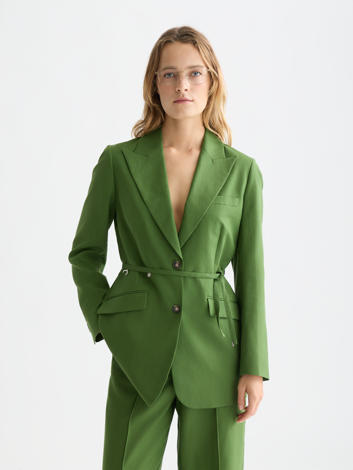 Linen-blend blazer by Scotch & Soda featuring a tailored fit and classic lapel in a neutral color, displayed on a hanger.