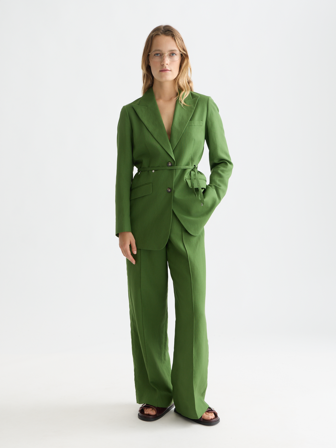 Linen-blend blazer from Scotch & Soda, tailored fit with classic lapels, shown in a neutral color on a hanger.