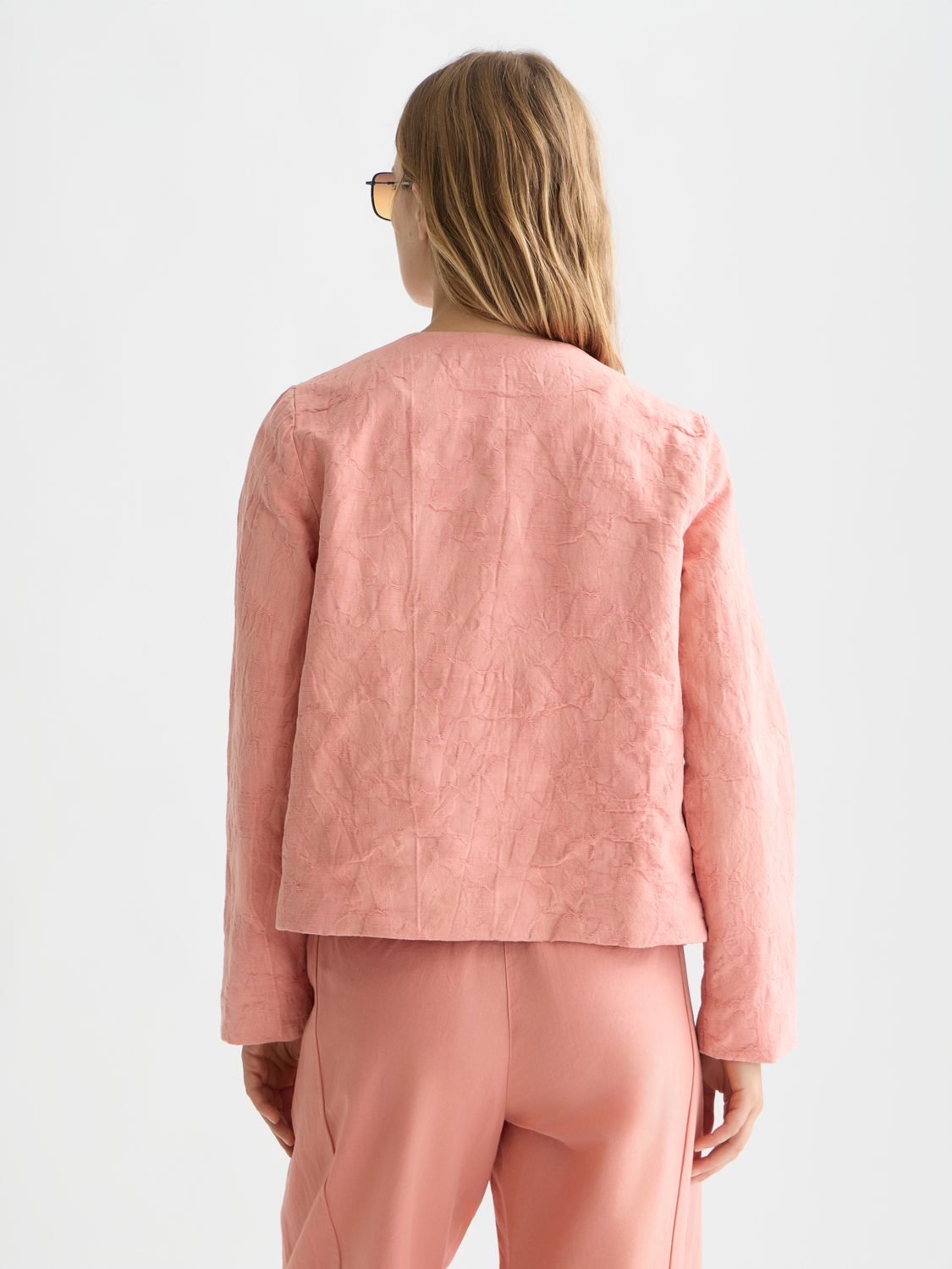 Structured jacquard blazer by Scotch & Soda, showing the tailored fit and detailed pattern from the back view.
