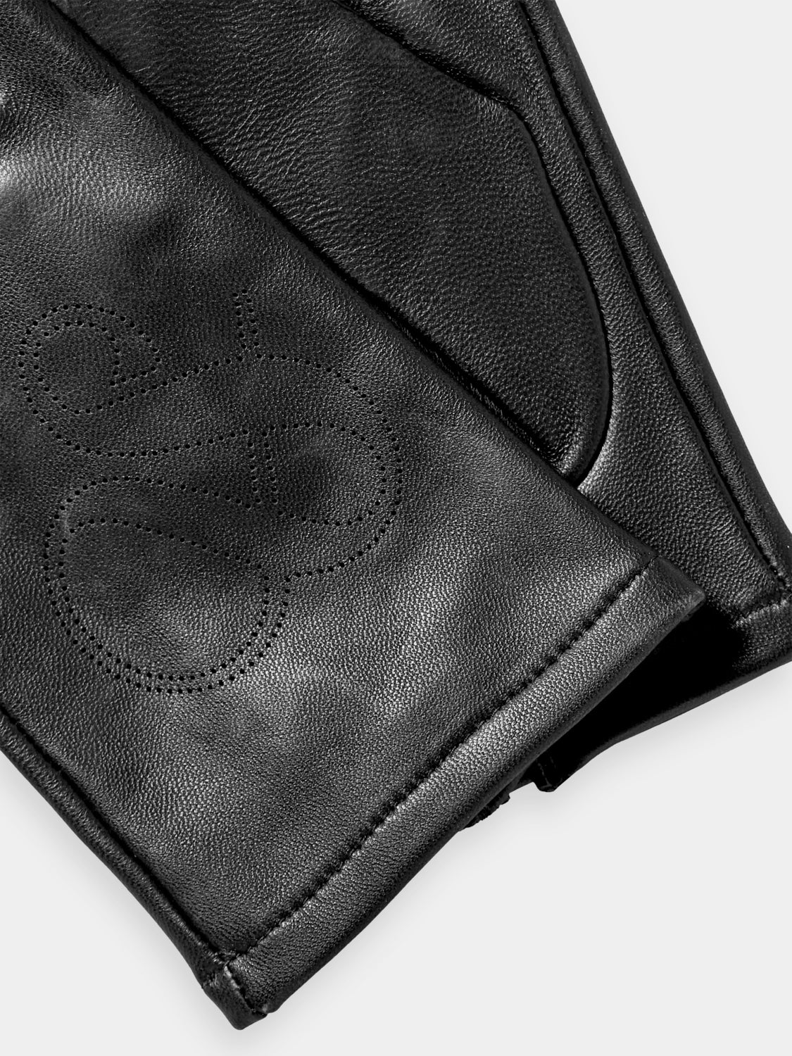 Perforated leather gloves in black by Scotch & Soda, featuring stylish cut-out details and a snug fit.