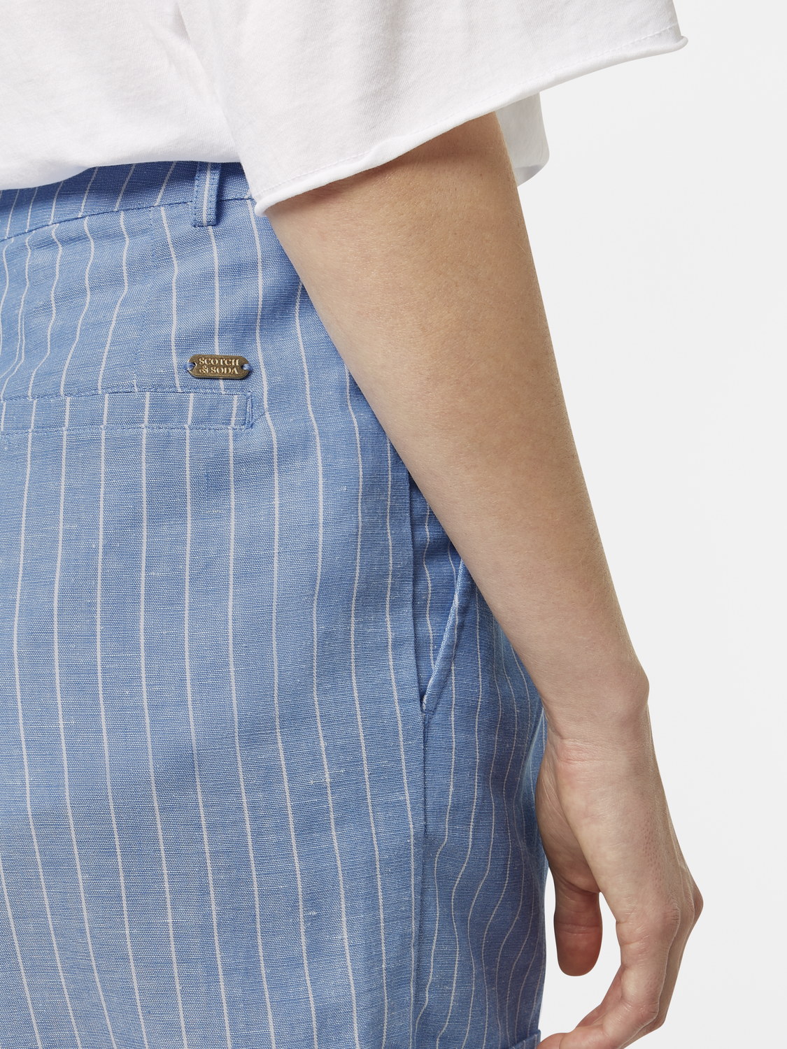 Printed Scotch & Soda shorts featuring vibrant patterns and a relaxed fit, displayed on a model.