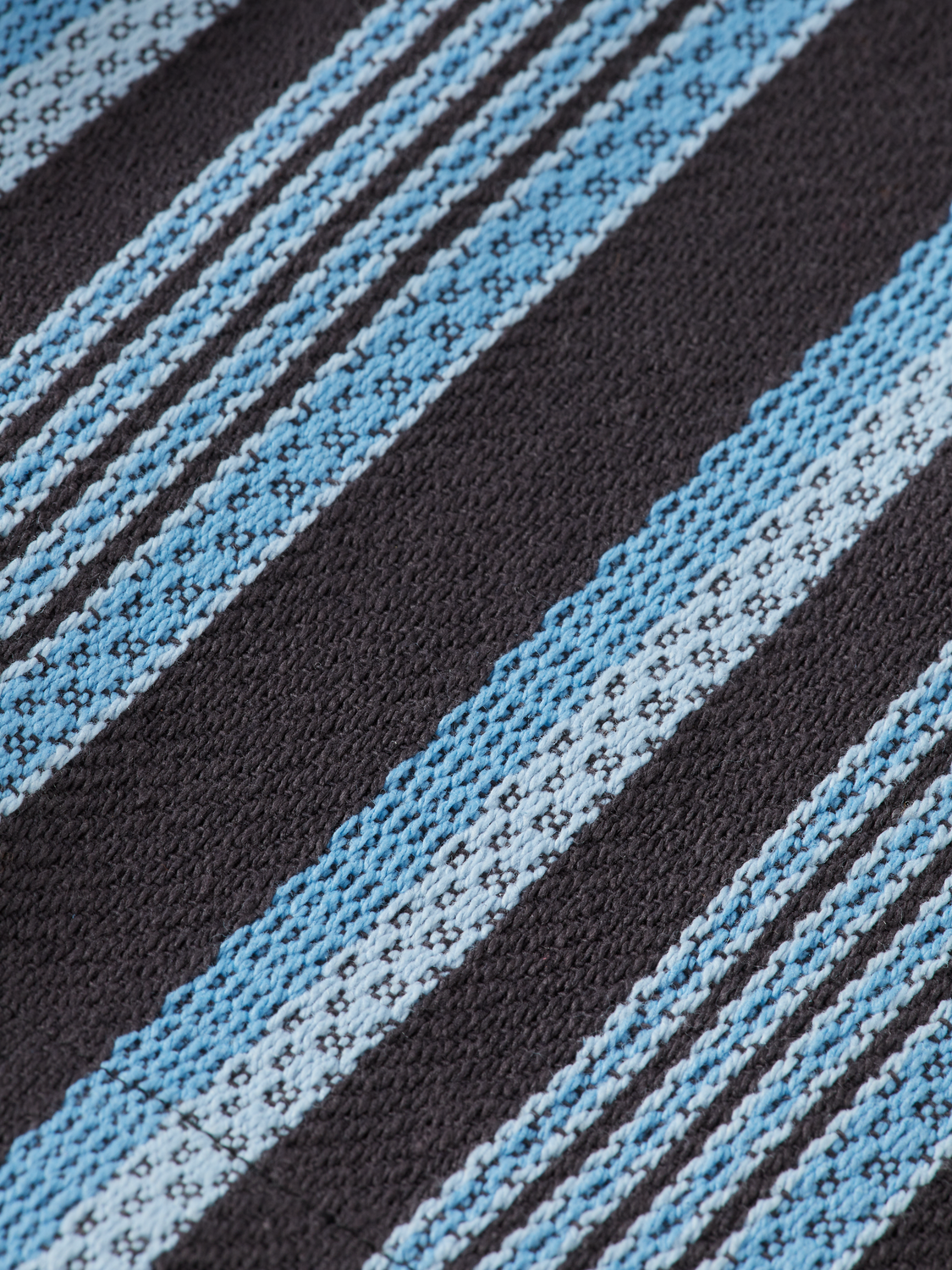 Striped shorts by Scotch & Soda featuring a casual fit and colorful pattern, shown laid flat on a white background.