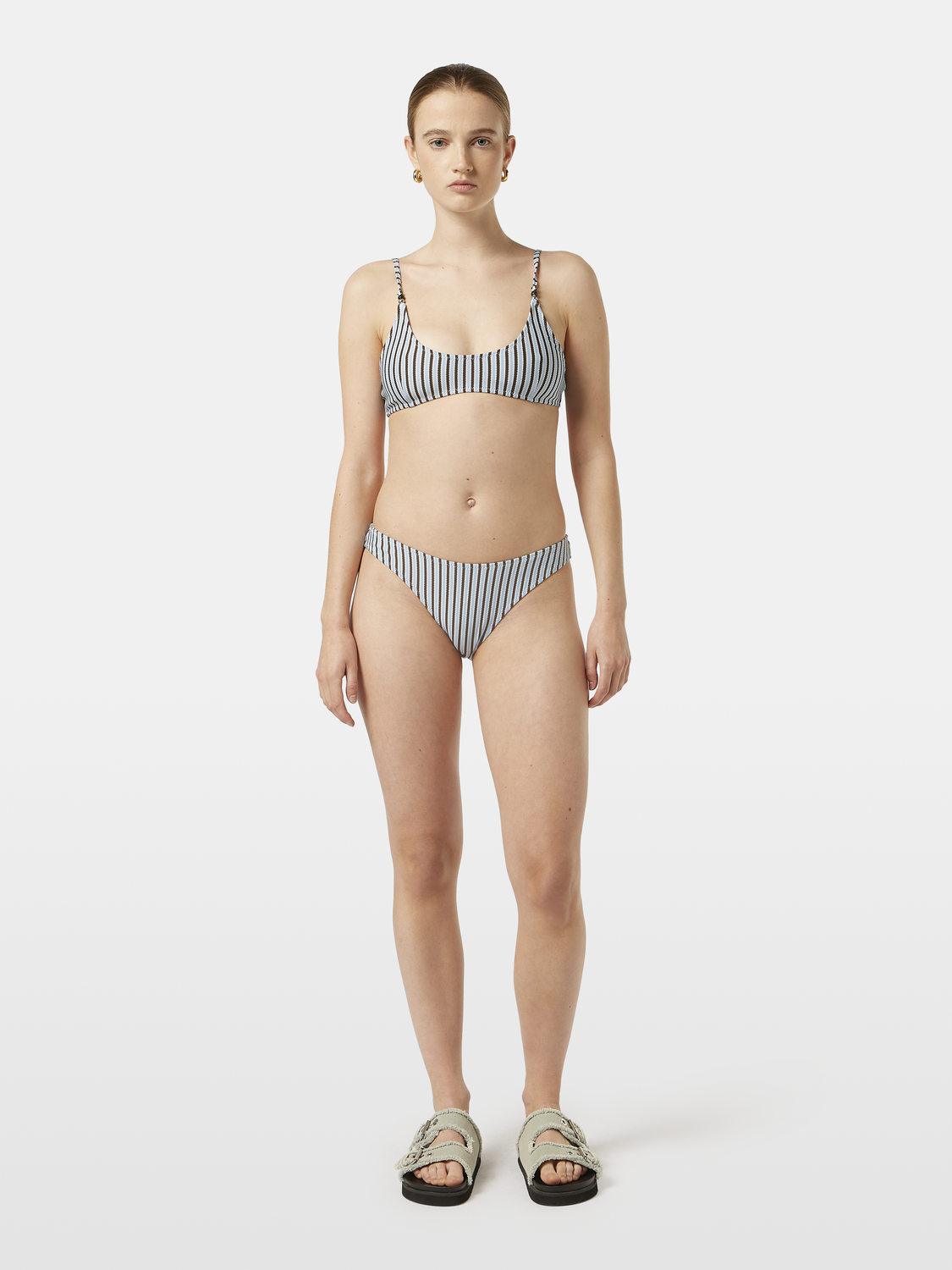 Striped bikini bottom from SCOTCH & SODA swimwear collection, featuring colorful horizontal stripes and a fitted design.