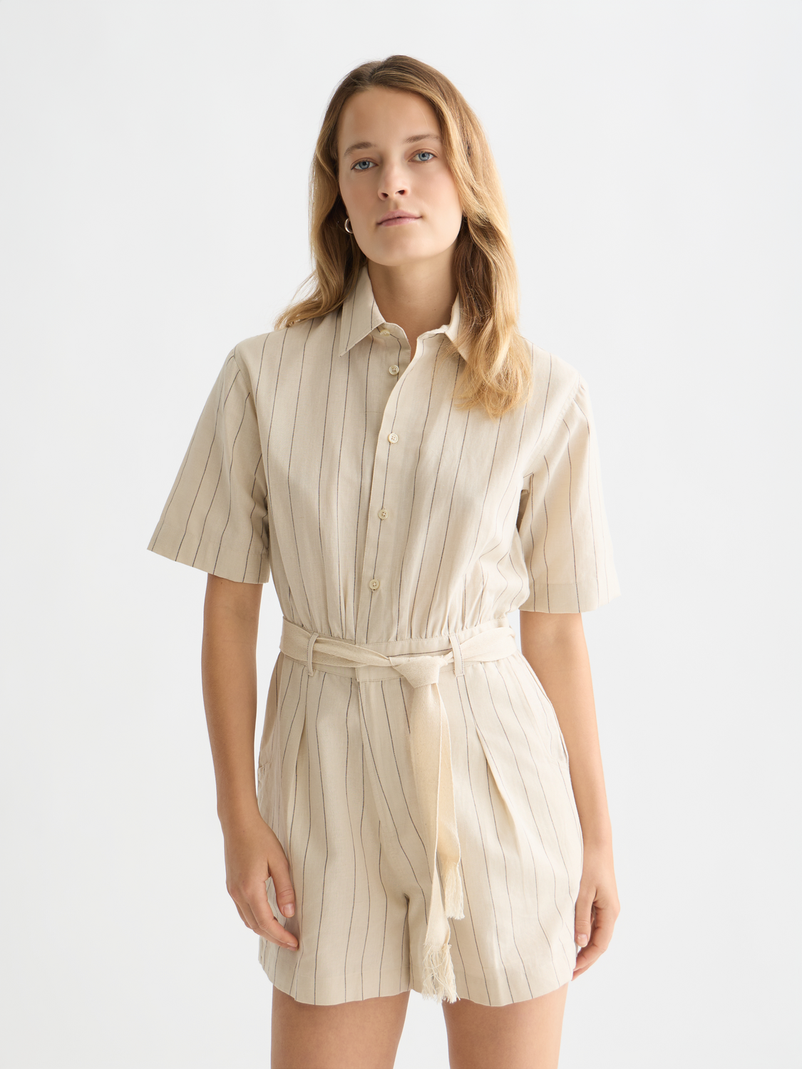 SCOTCH & SODA pinstripe playsuit featuring a sleeveless design, fitted waist, and tailored jumpsuit style with vertical pinstripes.