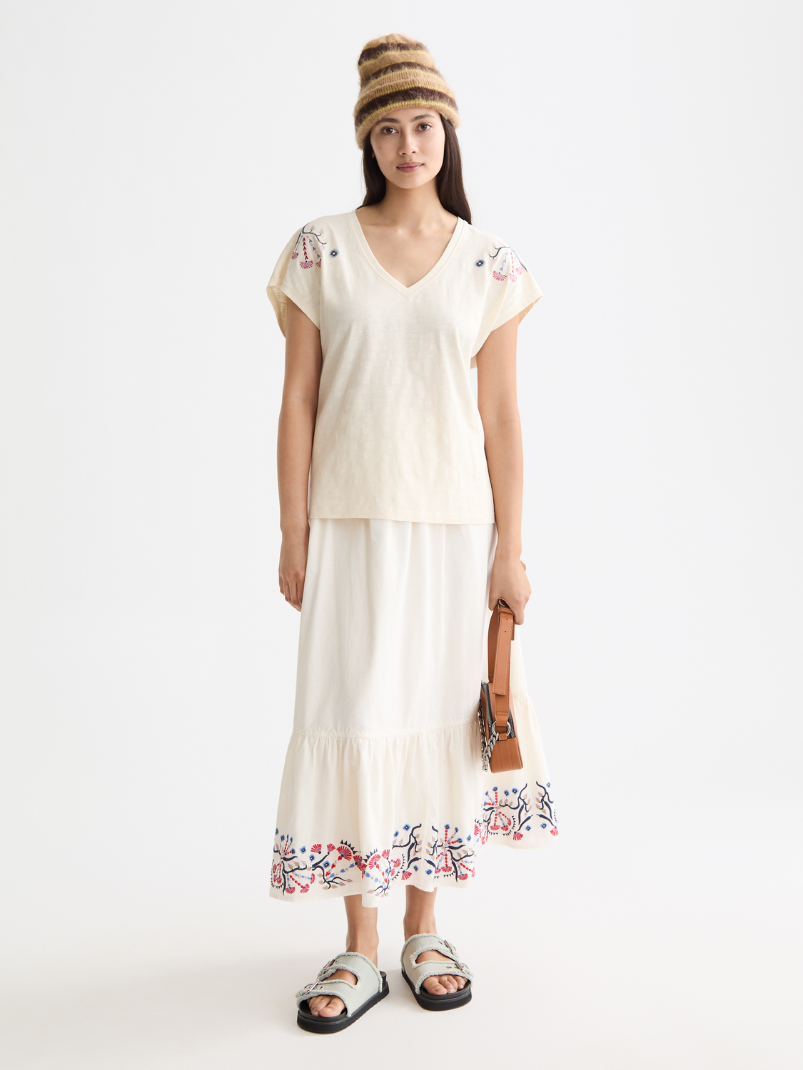Embroidered maxi skirt from Scotch & Soda featuring intricate floral embroidery and flowing fabric style.