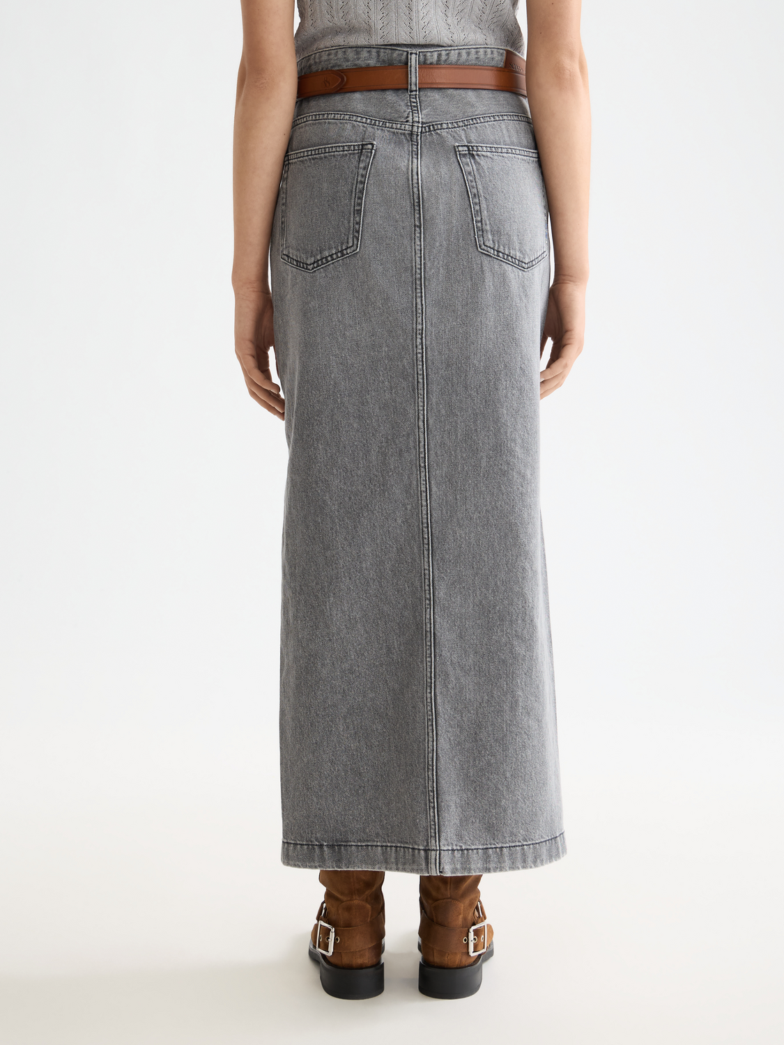 Denim maxi skirt by Scotch & Soda featuring a flowing design, high waist, and classic blue denim fabric.