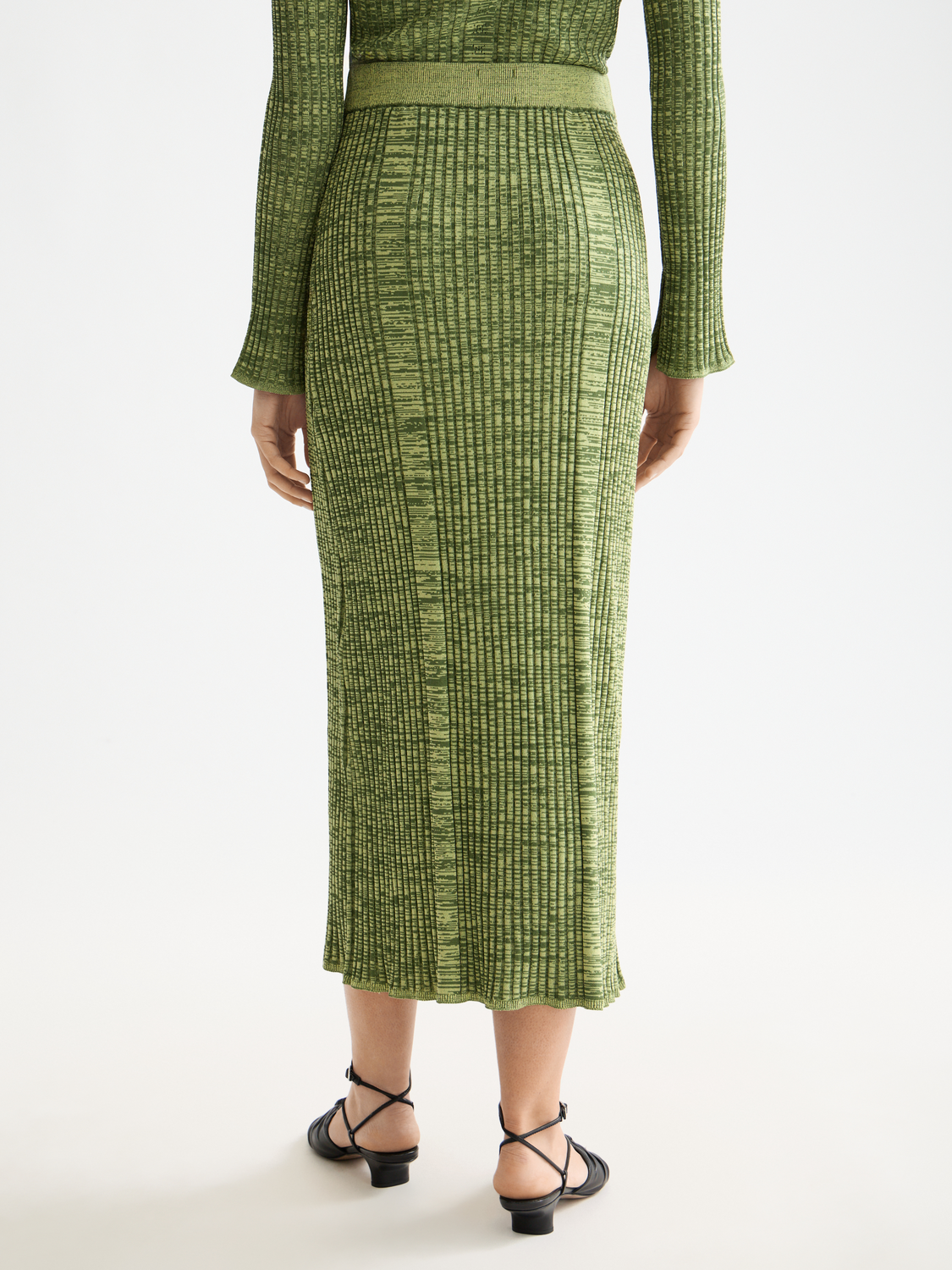 Black ribbed knitted maxi skirt by Scotch & Soda, featuring a fitted waist and flowing length, perfect for casual or chic outfits.