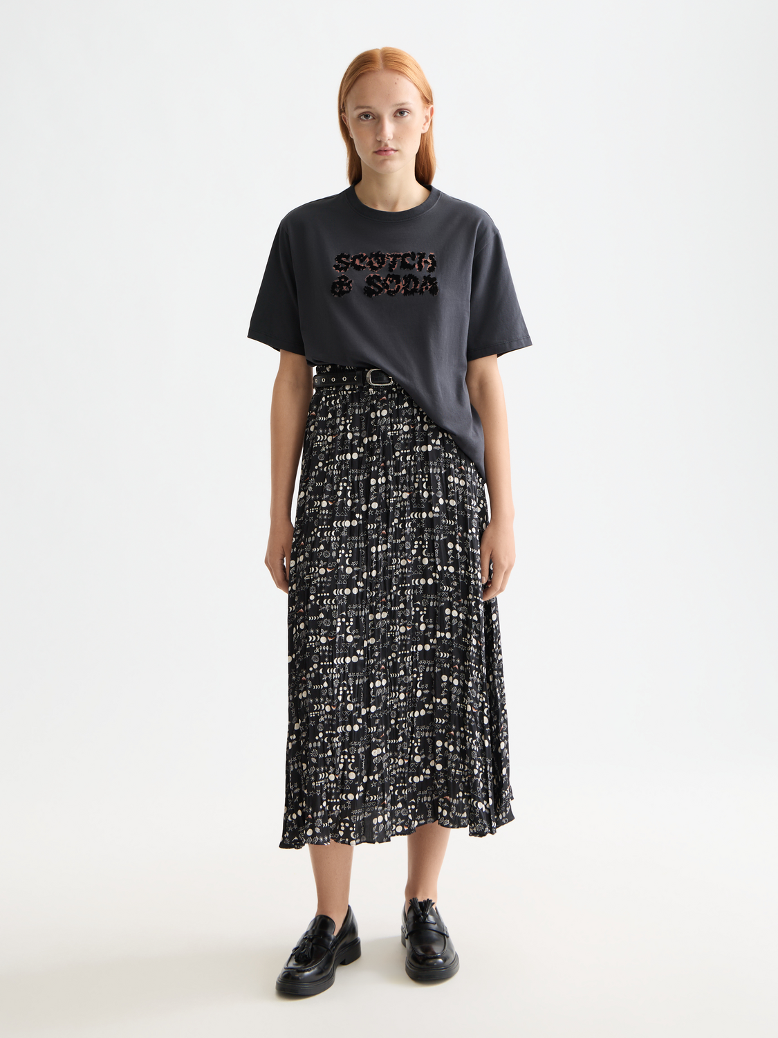Crinkle pleated midi skirt by Scotch & Soda featuring flowing fabric and a stylish midi length, shown on a model.