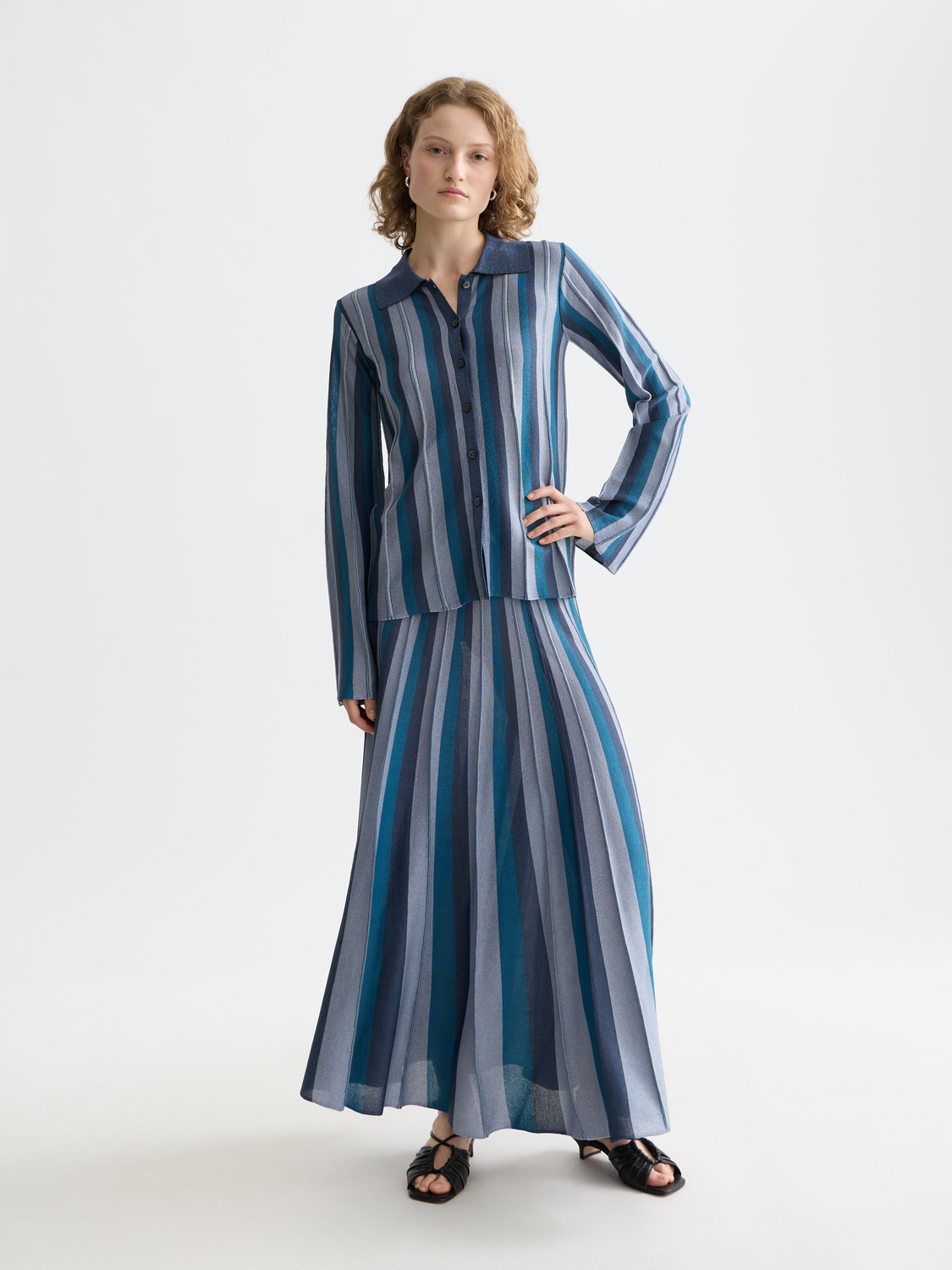 Pleated knit midi skirt by Scotch & Soda, featuring a stylish design with a high waist and flowing silhouette.
