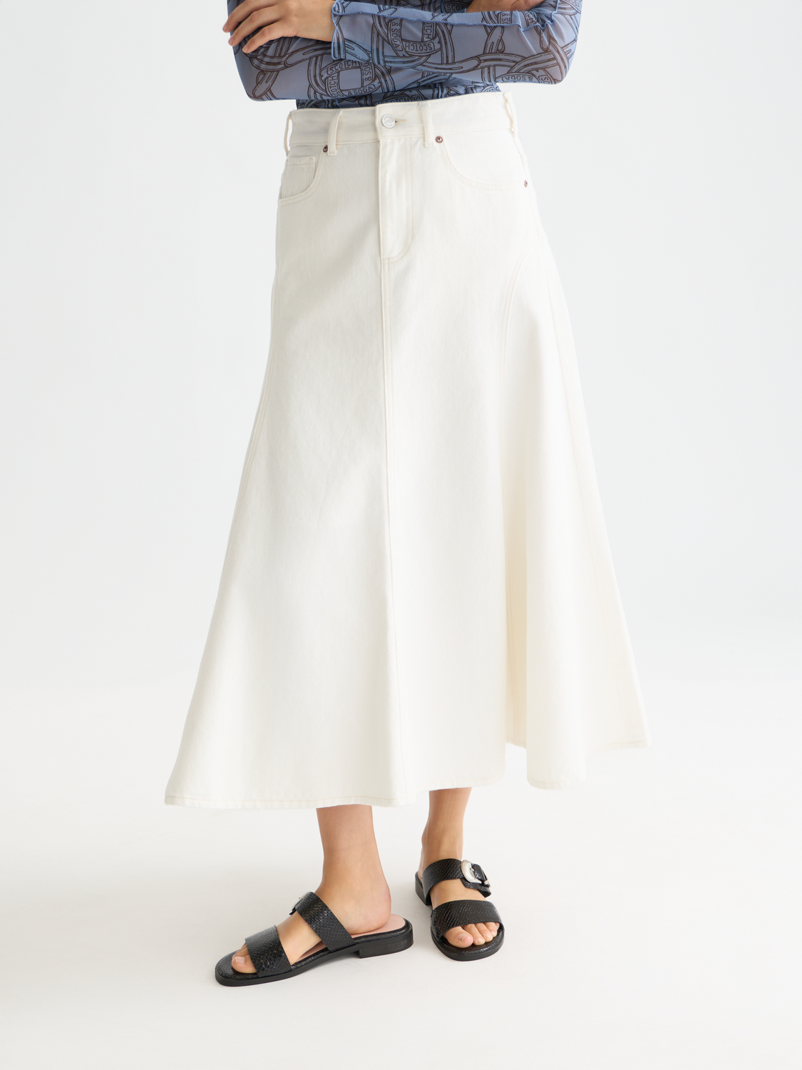Denim maxi skirt from Scotch & Soda featuring a high waist, flowing design, and classic denim wash, shown from front view.