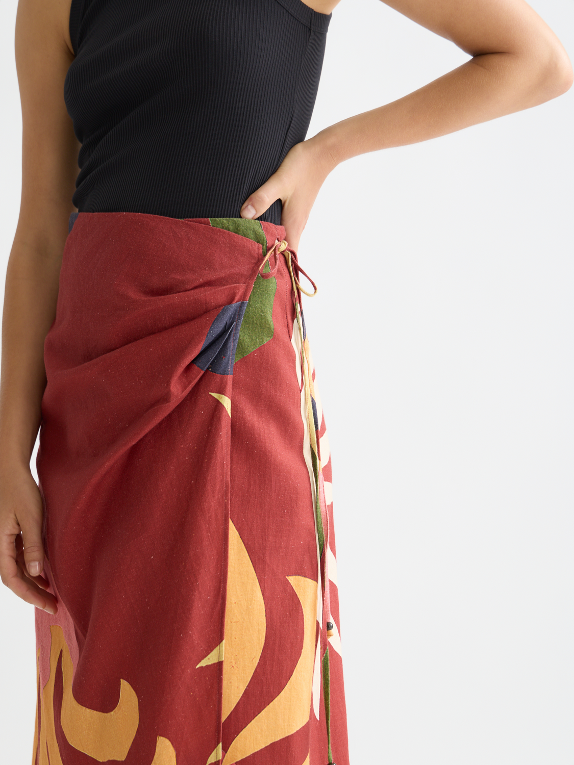 Linen wrap skirt by Scotch & Soda featuring a lightweight, beige fabric with a tie waist and relaxed fit.
