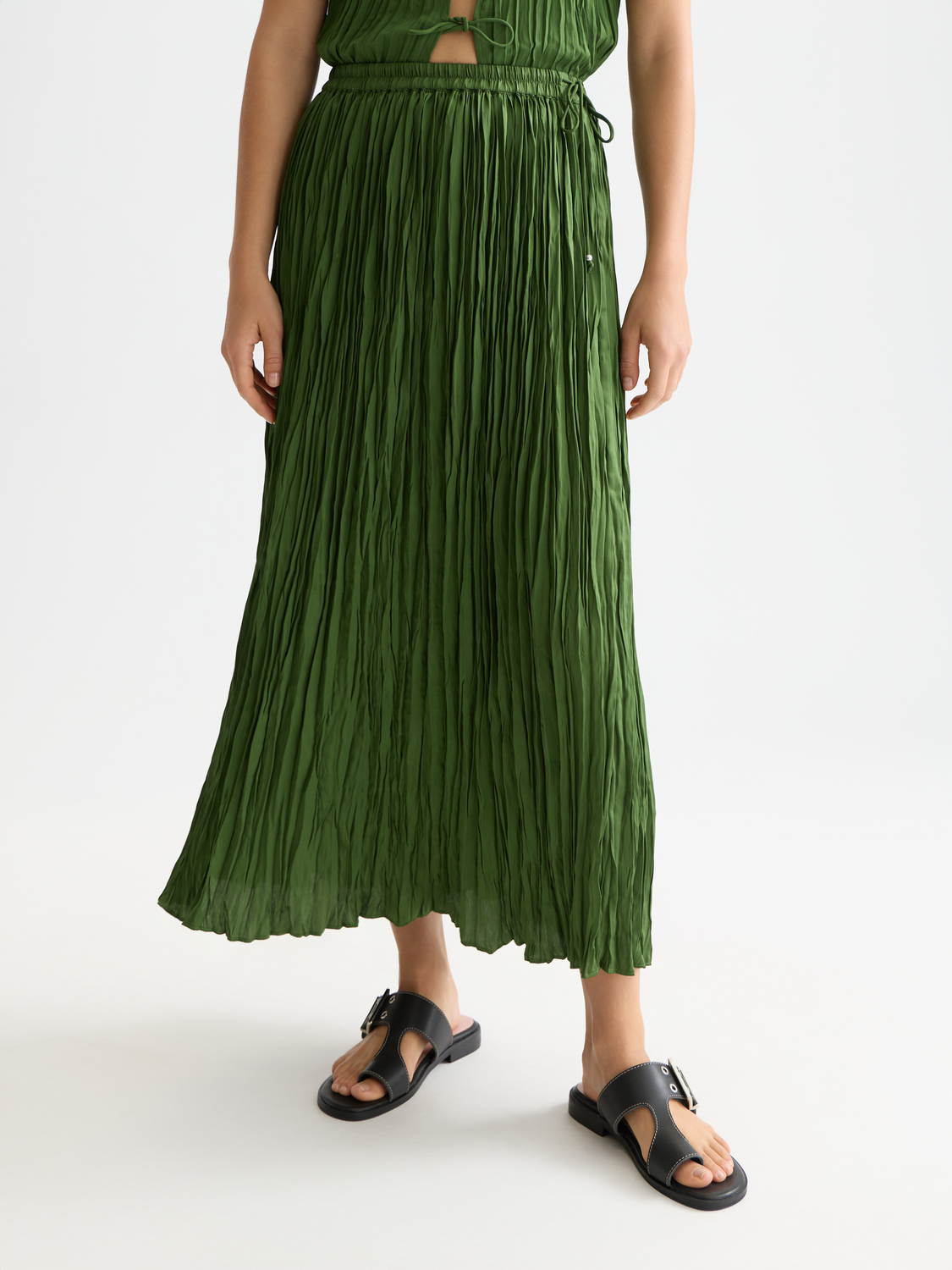 Micro pleat skirt by Scotch & Soda featuring a high-waisted design and soft fabric with fine pleats, front view.