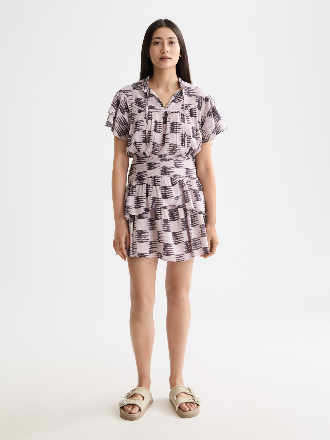 Scotch & Soda ruffled mini dress featuring a flowy silhouette and feminine details, shown in a front view.