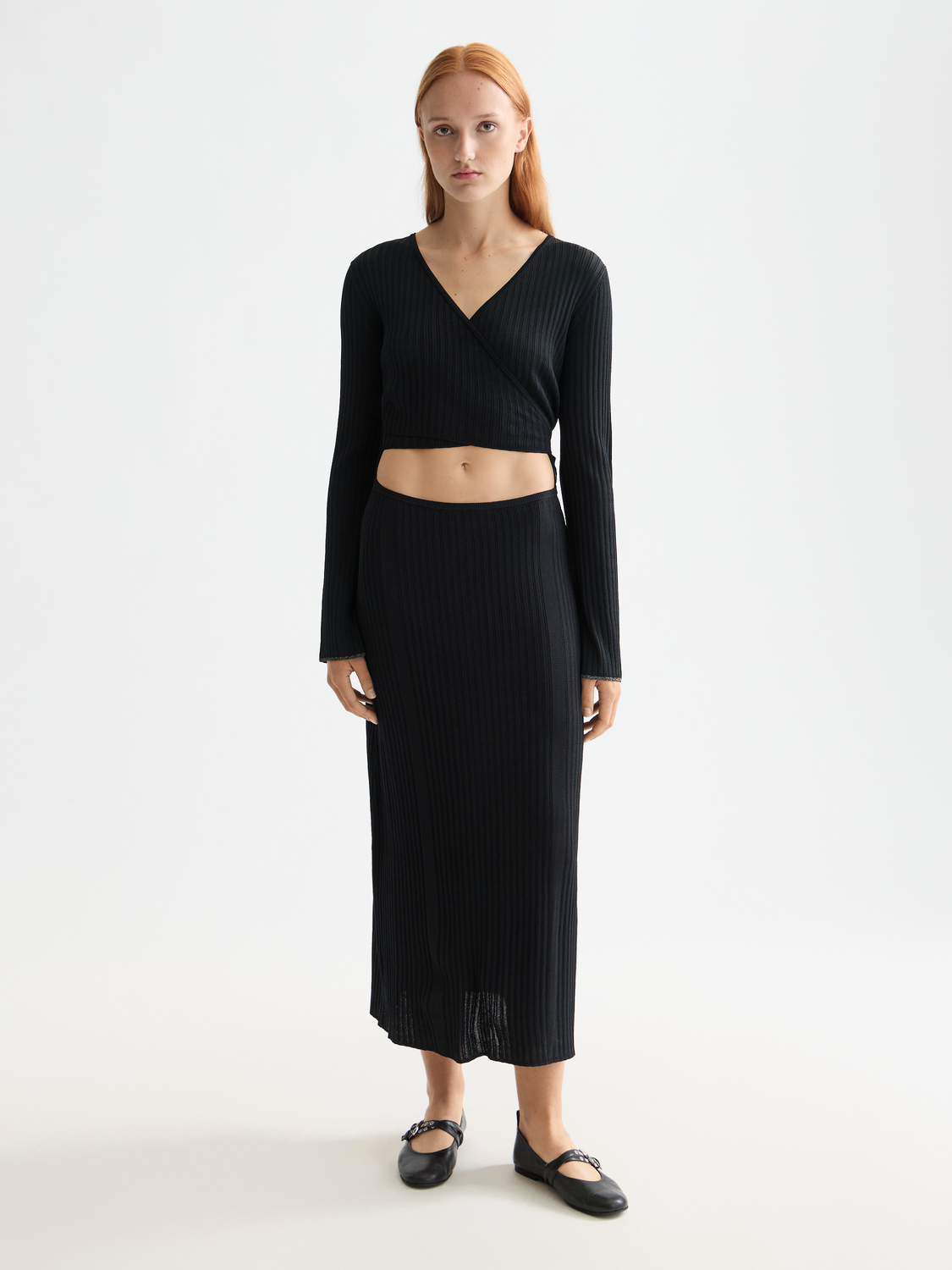 Ribbed wrap dress by Scotch & Soda, shown in a close-up of the front featuring the textured fabric and fit.