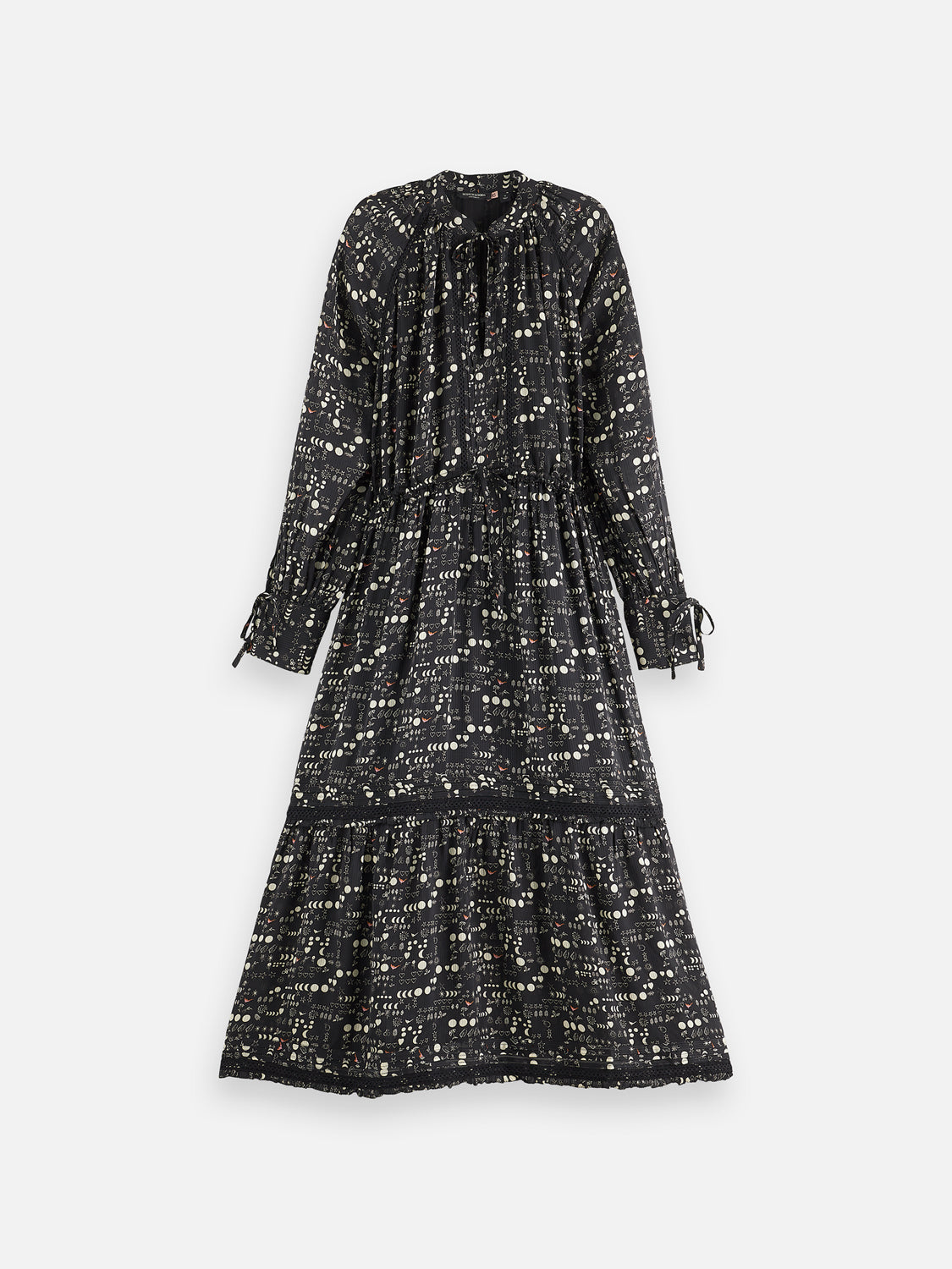 Scotch & Soda tiered maxi dress with flowing fabric, sleeveless design, and vibrant floral pattern on a model.
