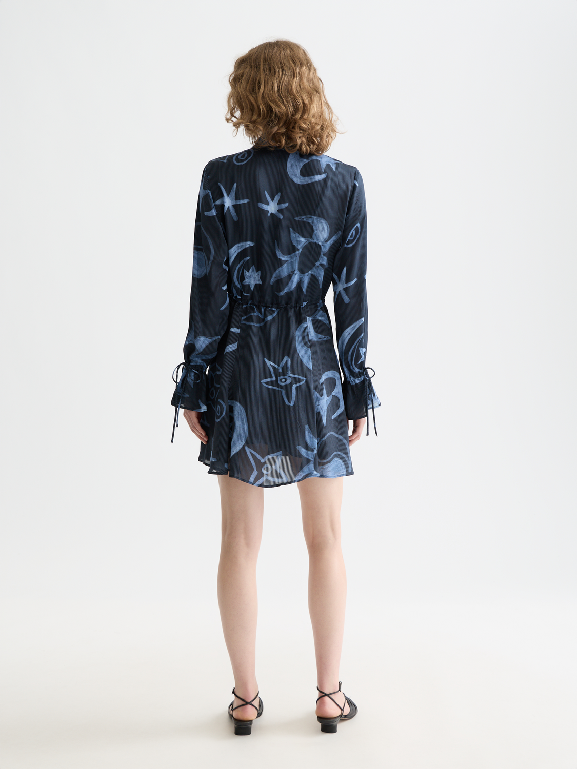 Printed mini dress from SCOTCH & SODA featuring a vibrant floral pattern and a fitted silhouette.