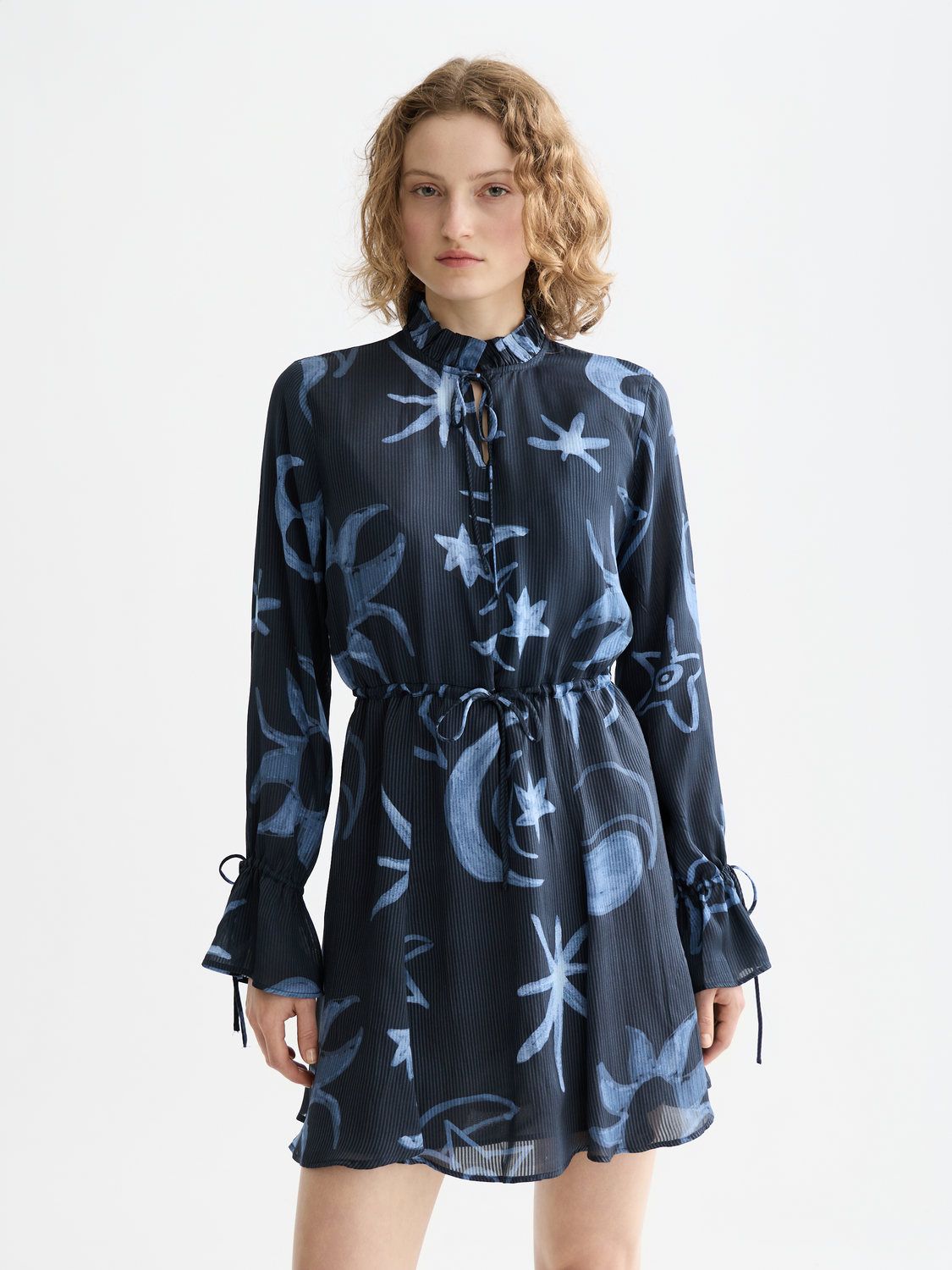 Printed mini dress by Scotch & Soda featuring vibrant floral patterns and a fitted silhouette perfect for casual and chic occasions.