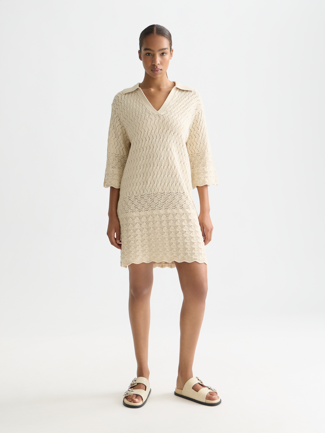 Pointelle knitted SCOTCH & SODA tunic dress featuring a relaxed fit and intricate open-knit pattern, worn by a model.