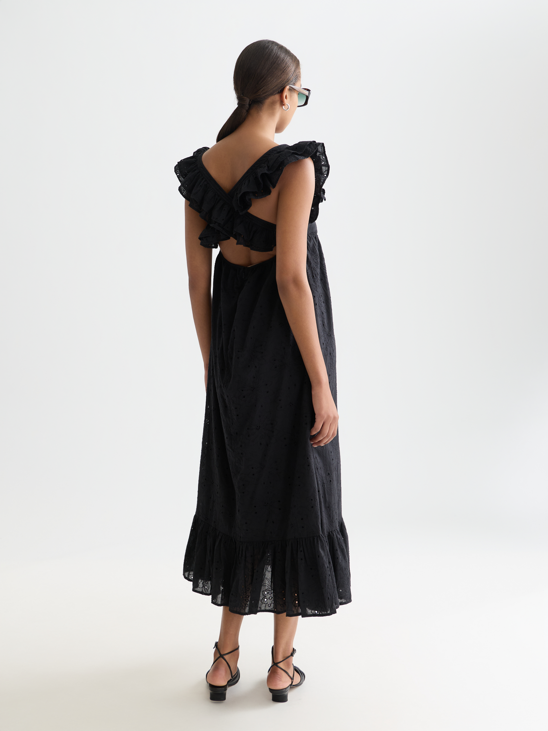 Scotch & Soda white broderie anglaise maxi dress with intricate embroidery and flowing silhouette, back view.