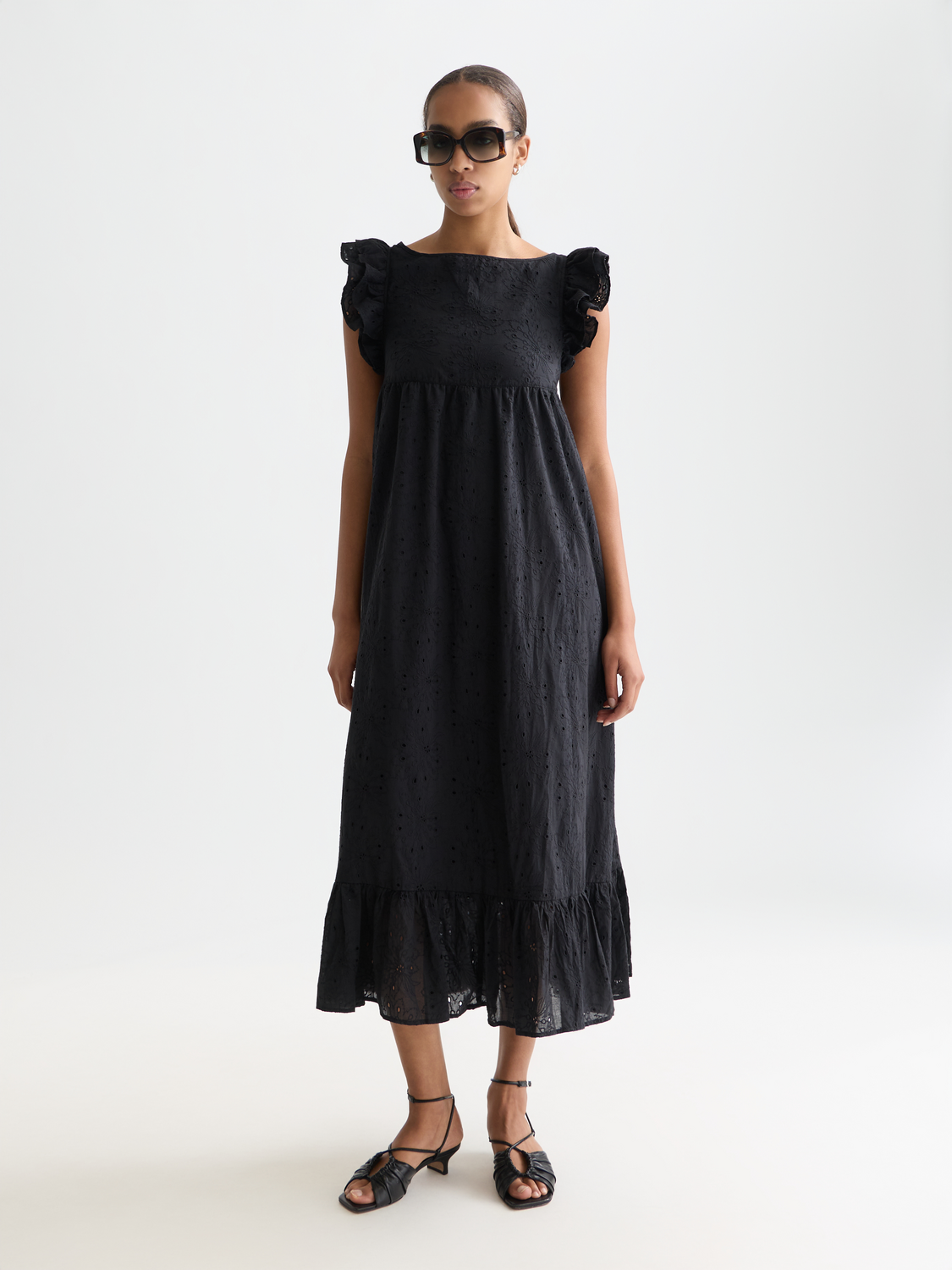 Scotch & Soda broderie anglaise maxi dress with intricate embroidery, flowing fabric, and a feminine silhouette.