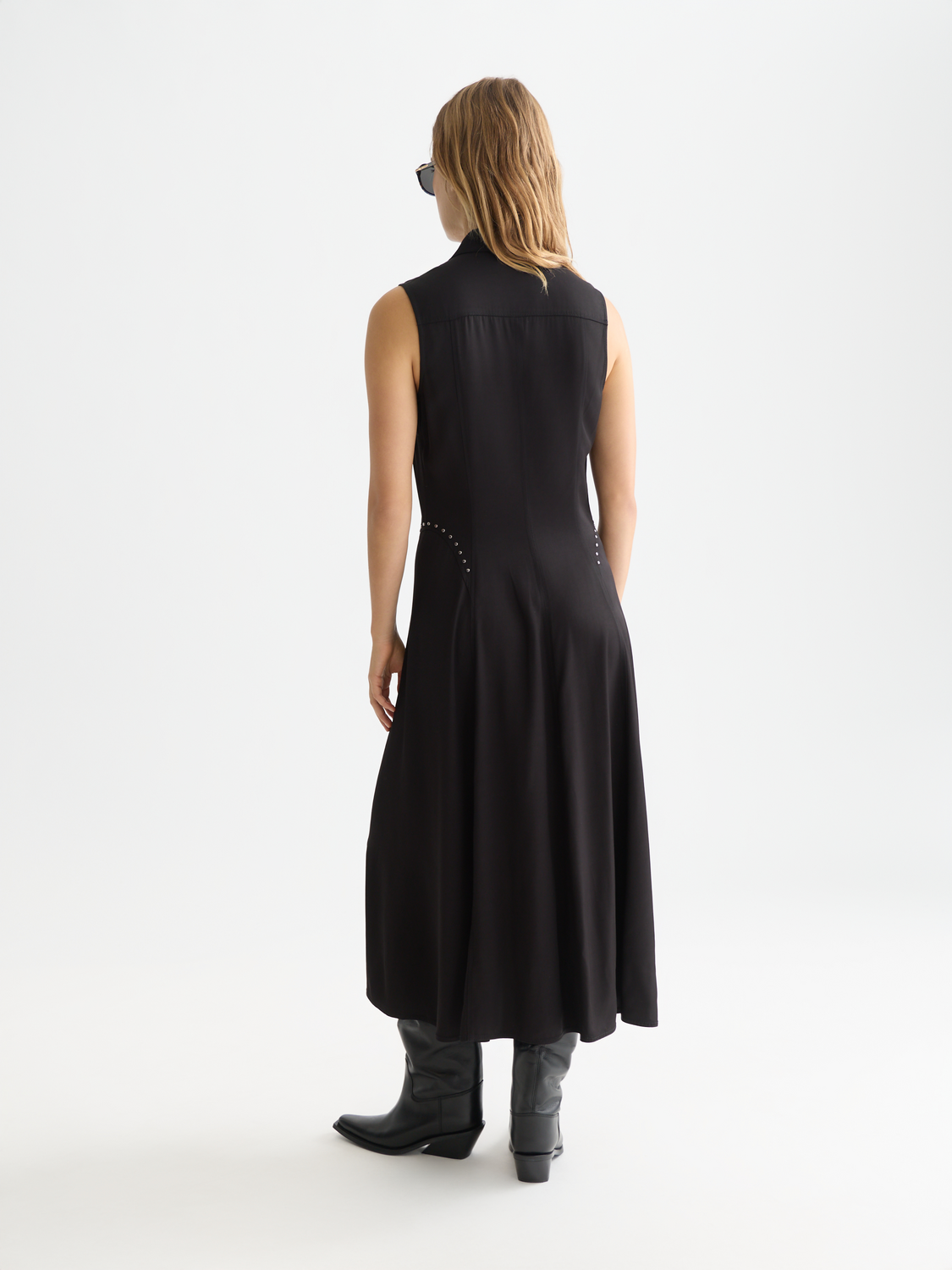 Black studded button midi dress by Scotch & Soda, featuring a fitted silhouette and decorative button details on the front.