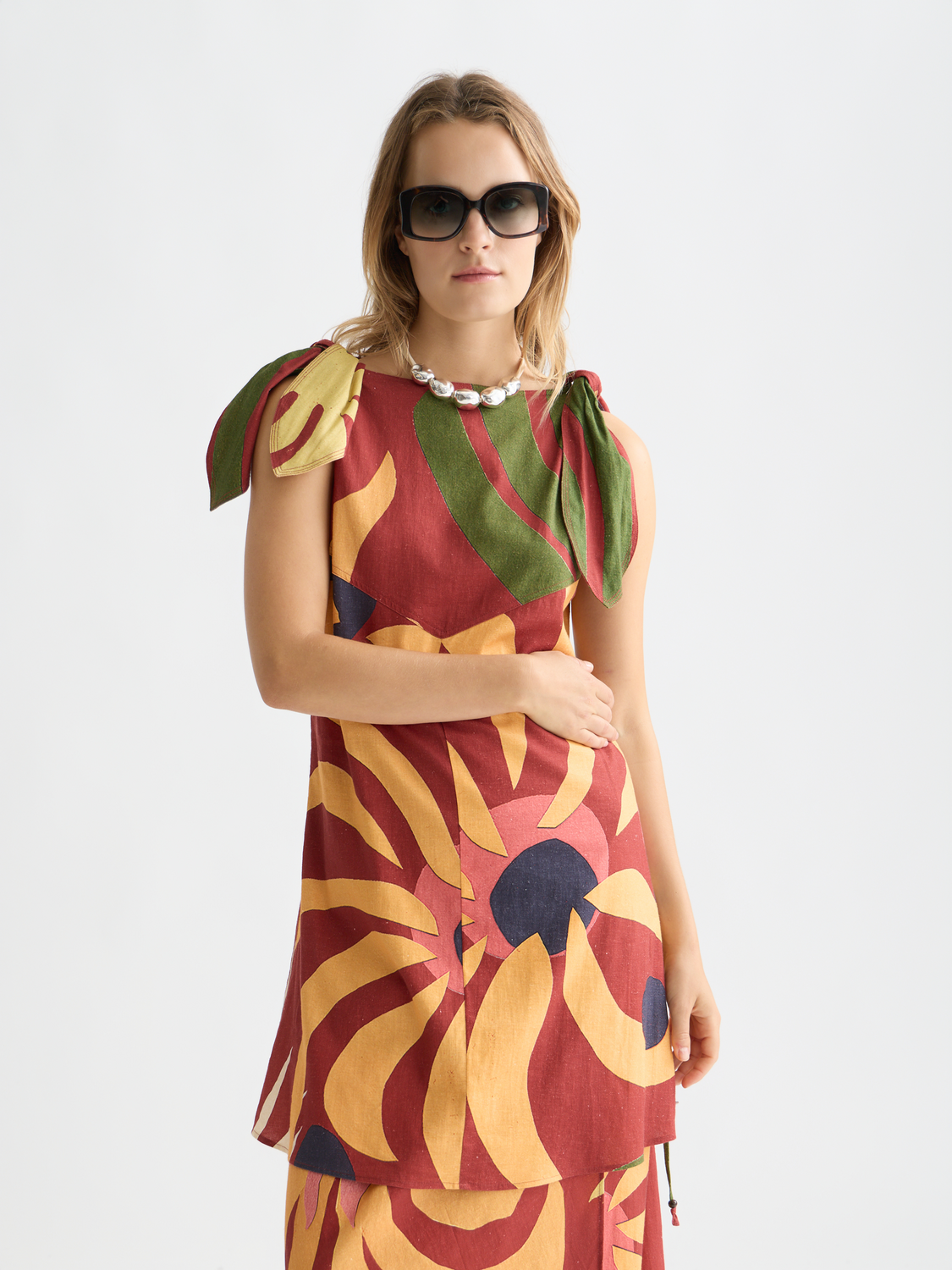 Printed mini dress from Scotch & Soda featuring a vibrant floral pattern, short sleeves, and a fitted silhouette.