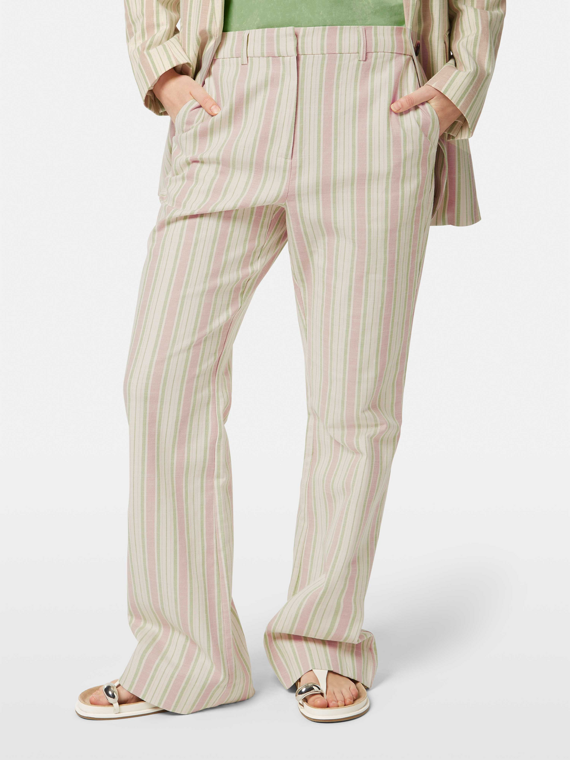 Lurex striped pants by Scotch & Soda featuring shiny metallic stripes and a relaxed fit on a model.