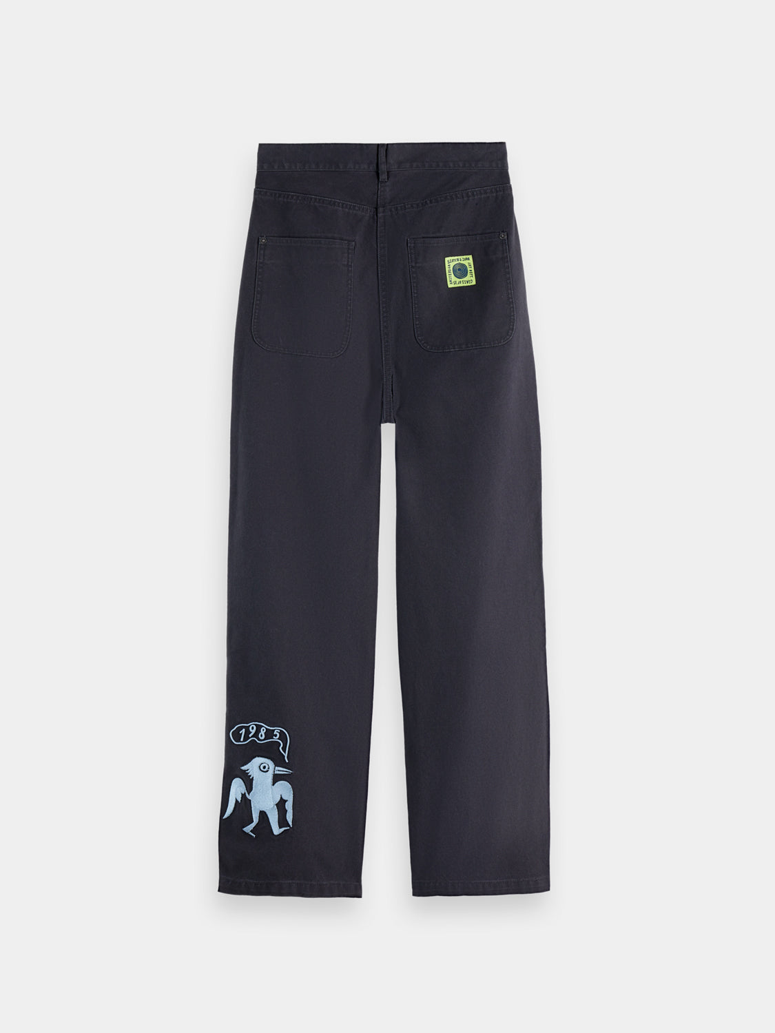 SCOTCH & SODA Raine wide-fit pants in dark fabric, shown from the back, featuring a relaxed silhouette and waistband detail.