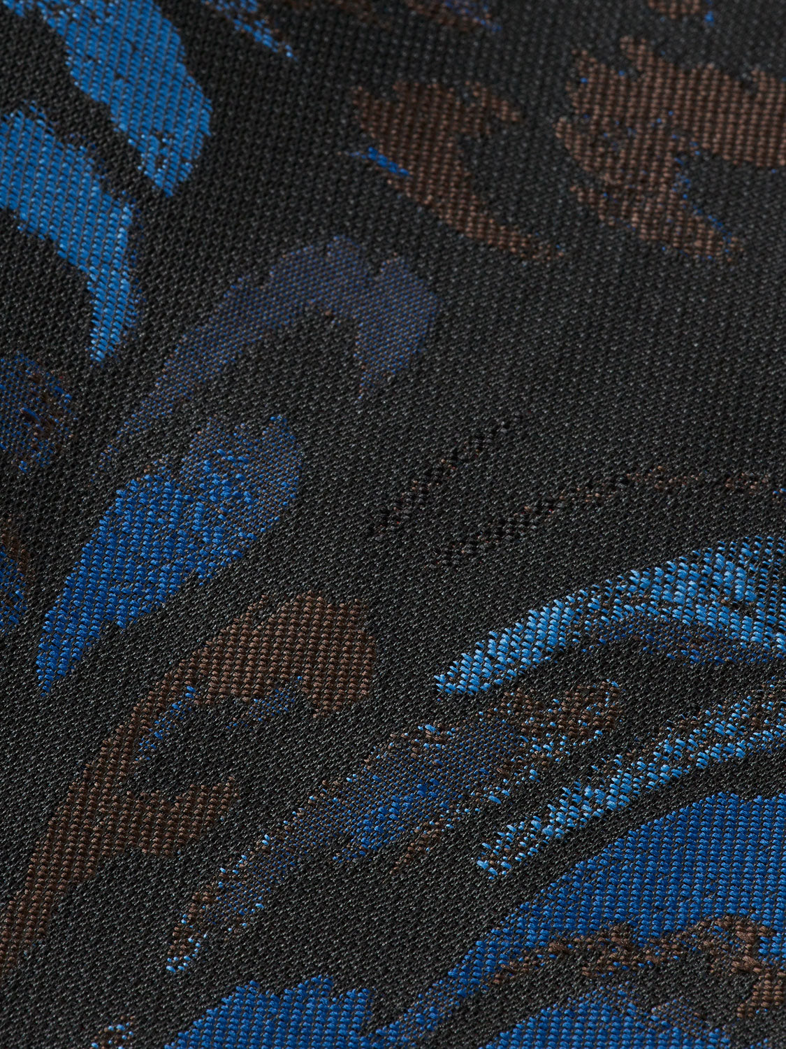 Scotch & Soda ripple jacquard pants showing their textured fabric, tailored fit, and stylish design in a neutral color.