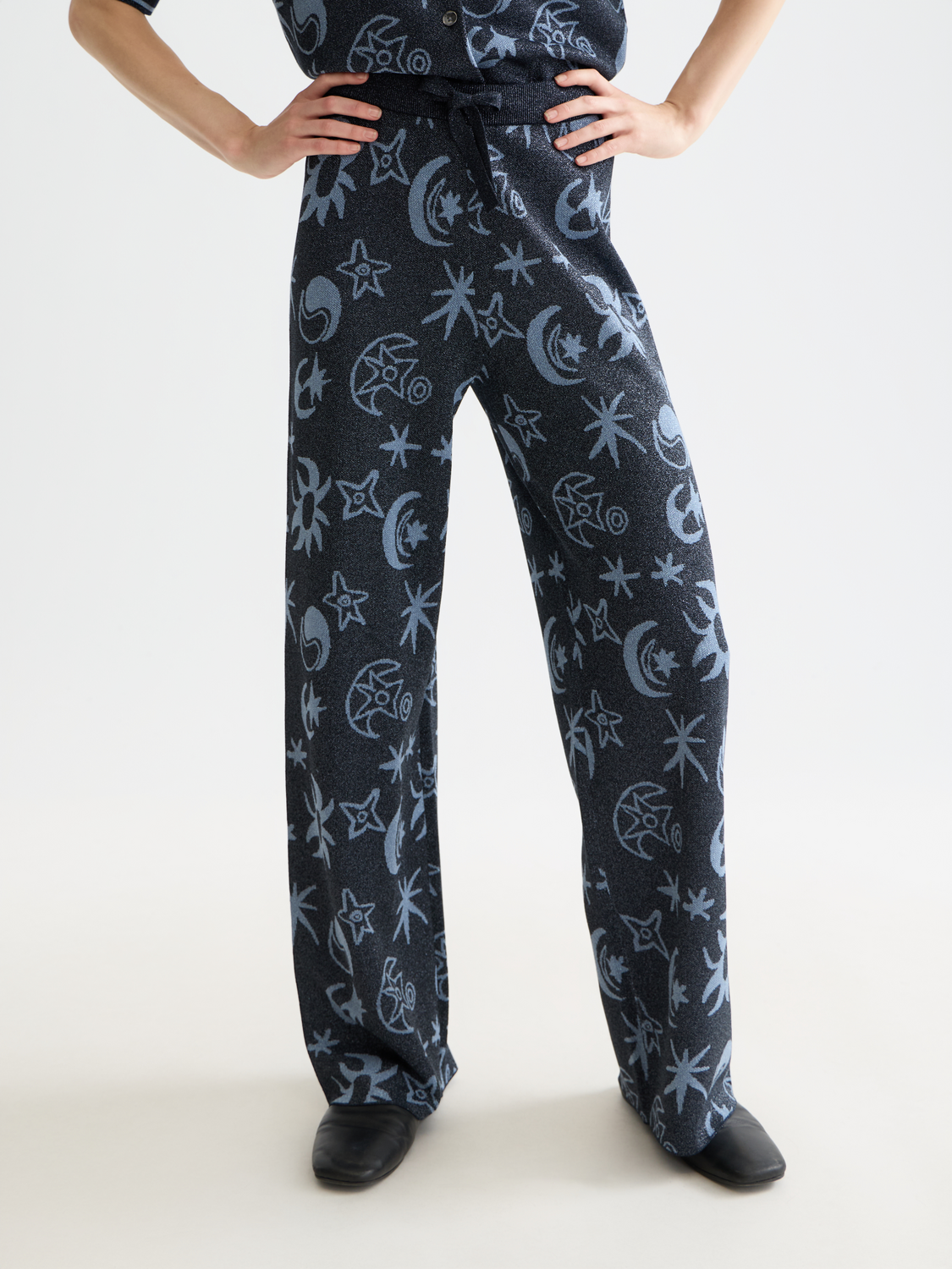 Jacquard knitted sweatpants by Scotch & Soda featuring a textured pattern and relaxed fit, shown in mauve color.