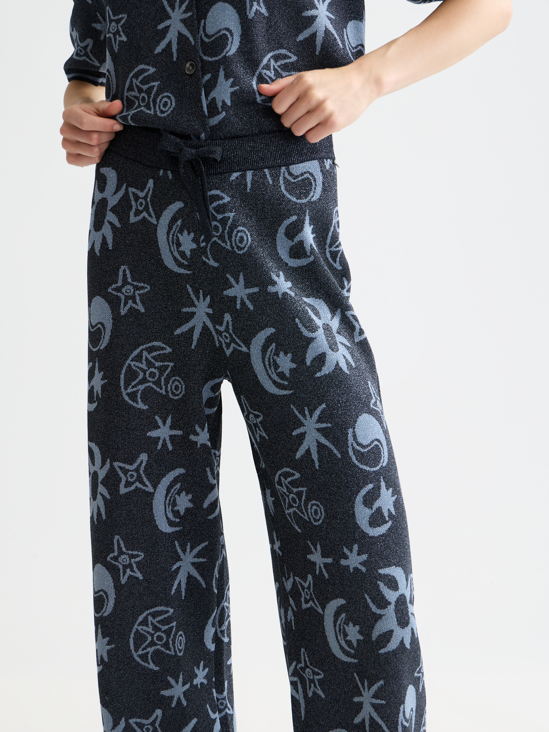 Jacquard knitted sweatpants by Scotch & Soda with a relaxed fit, featuring intricate woven patterns and ribbed cuffs.