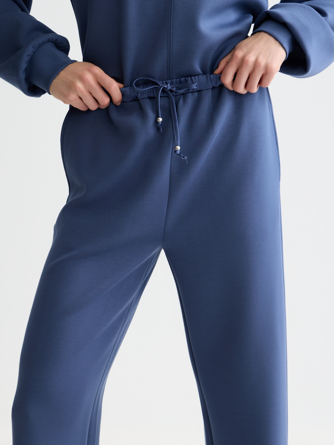 Gray modal sweatpants by Scotch & Soda with a relaxed fit and elastic waistband, shown on a hanger.