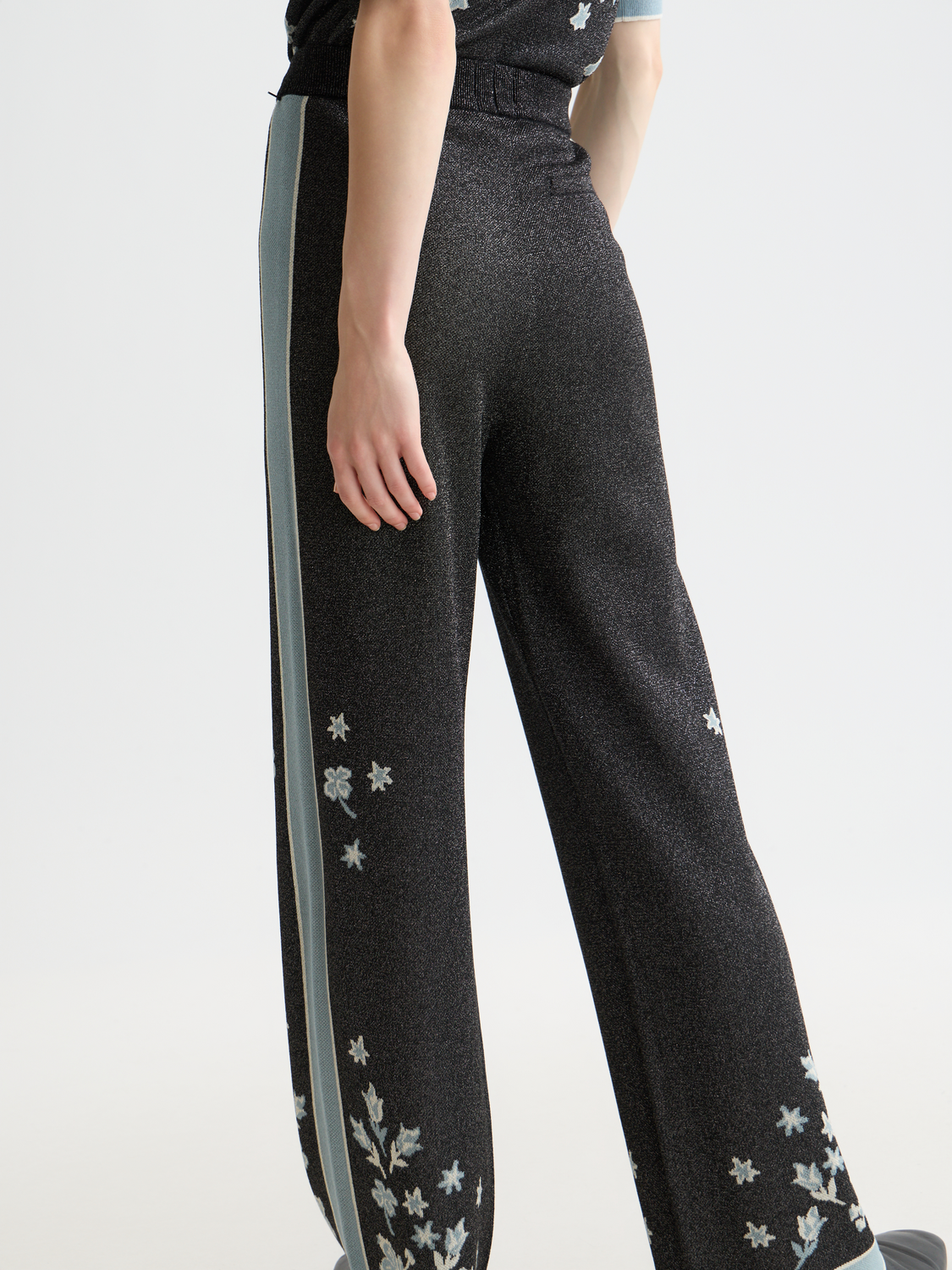 Jacquard knitted sweatpants by Scotch & Soda, featuring a textured pattern and relaxed fit, shown in a neutral color.