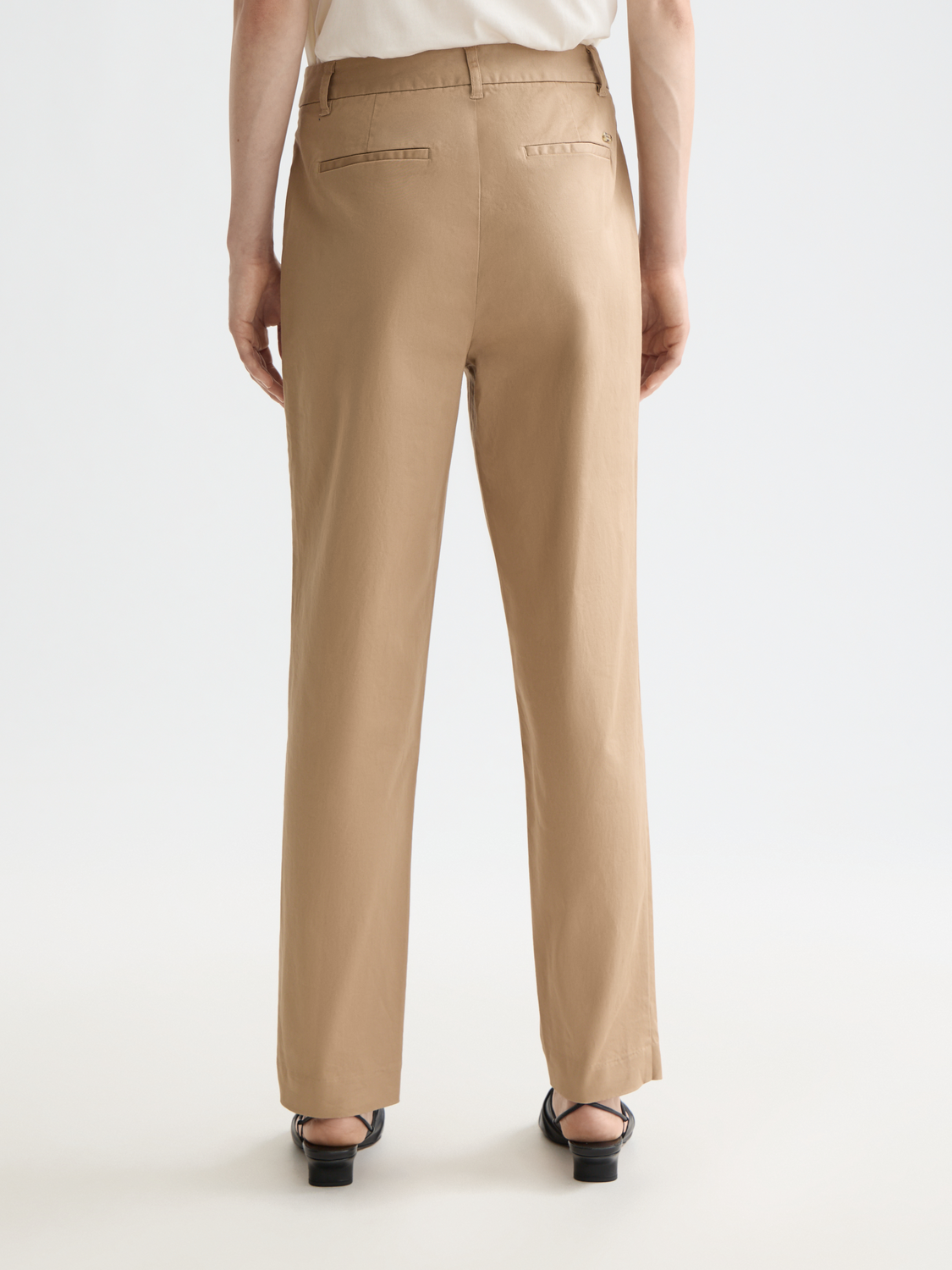 SCOTCH & SODA Abbott tapered chinos pants in dark color, shown from the back with a focus on fit and fabric texture.