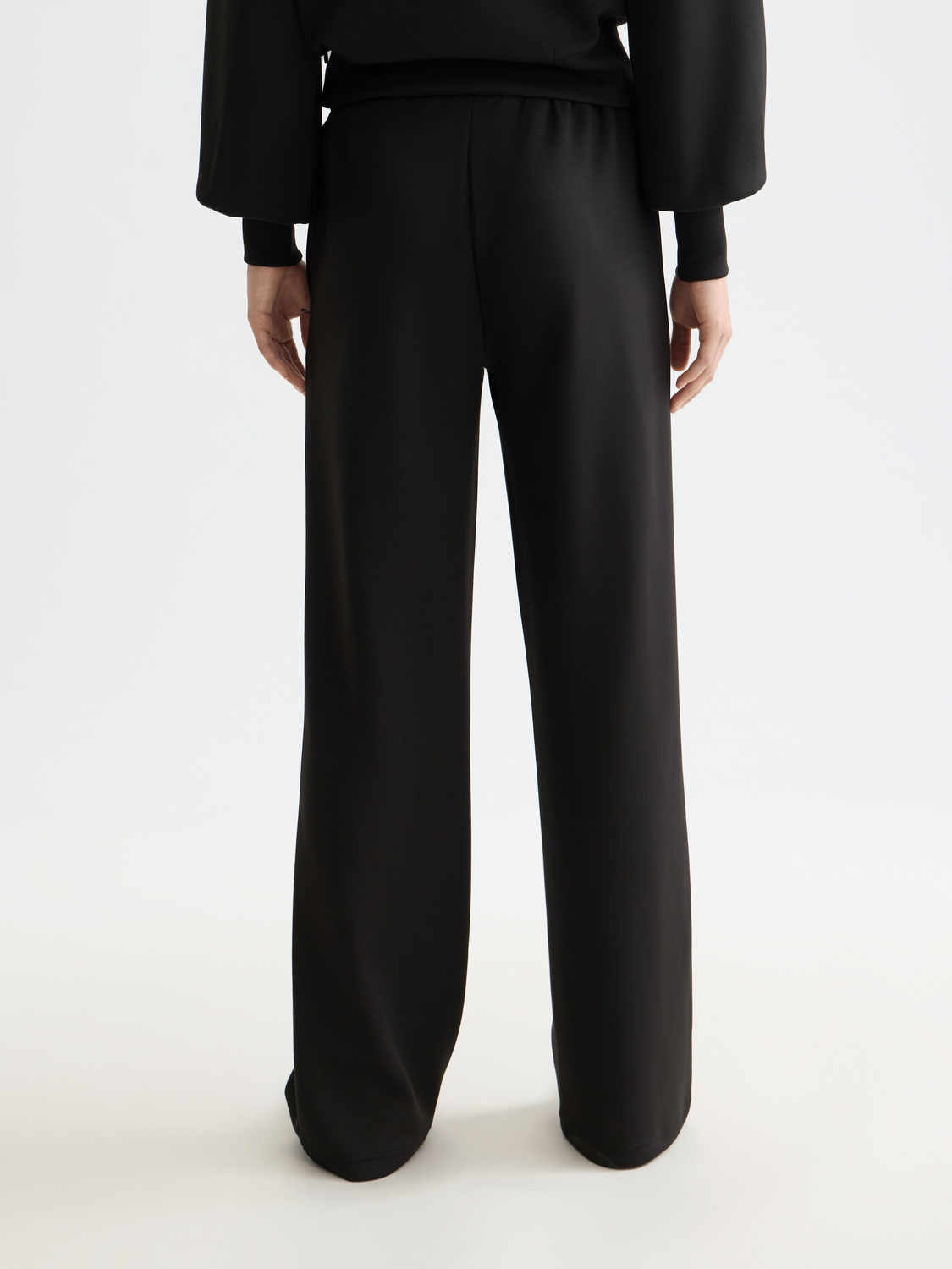 Back view of SCOTCH & SODA modal straight-fit sweatpants in soft fabric, featuring a relaxed fit and subtle branding details.