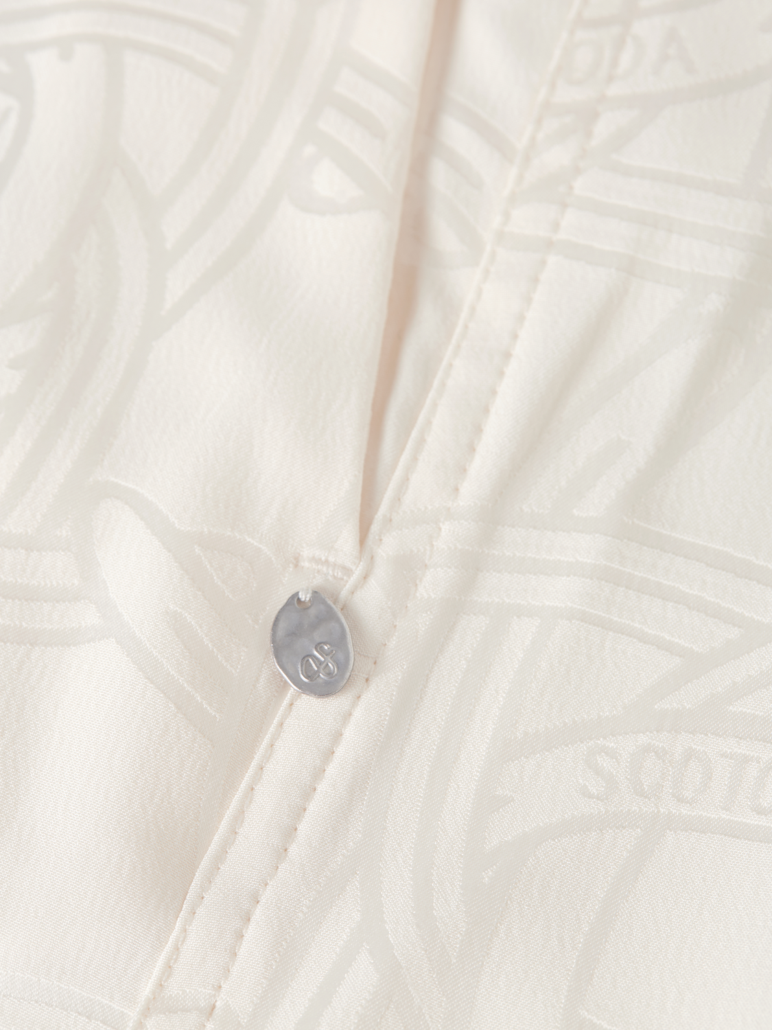 Eleni wide-fit pants by Scotch & Soda, showing beige fabric with a relaxed fit and stylish design, front view.