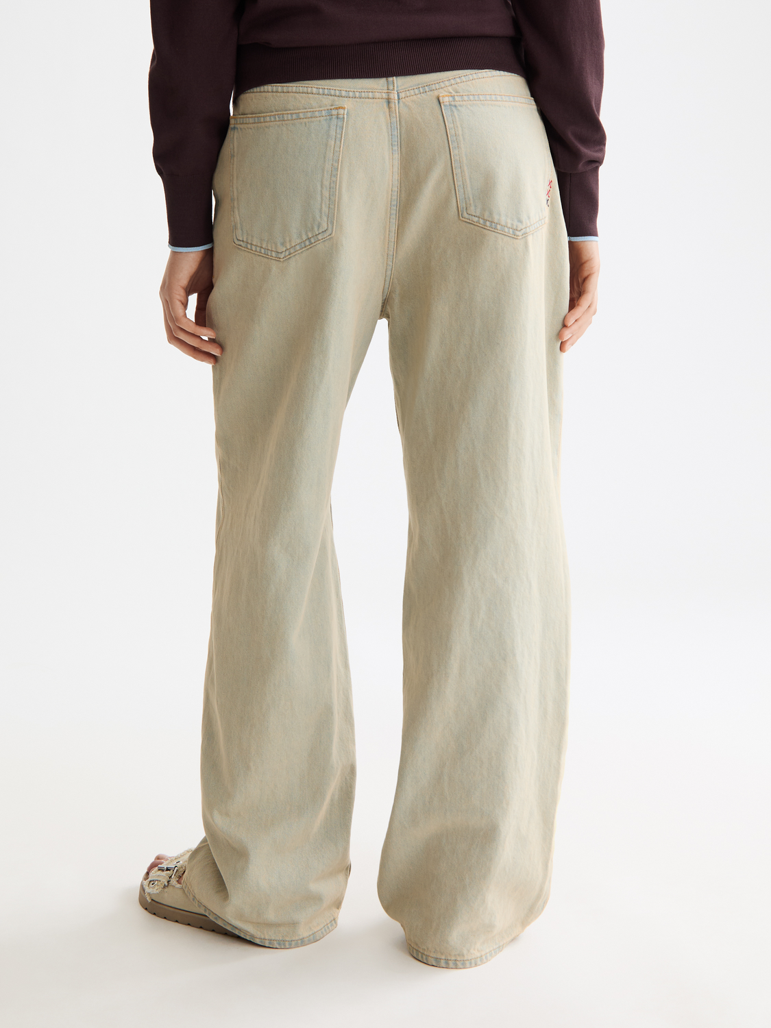 Deep loose-fit denim jeans by Scotch & Soda, shown from the back with a relaxed fit and classic stitching detail.
