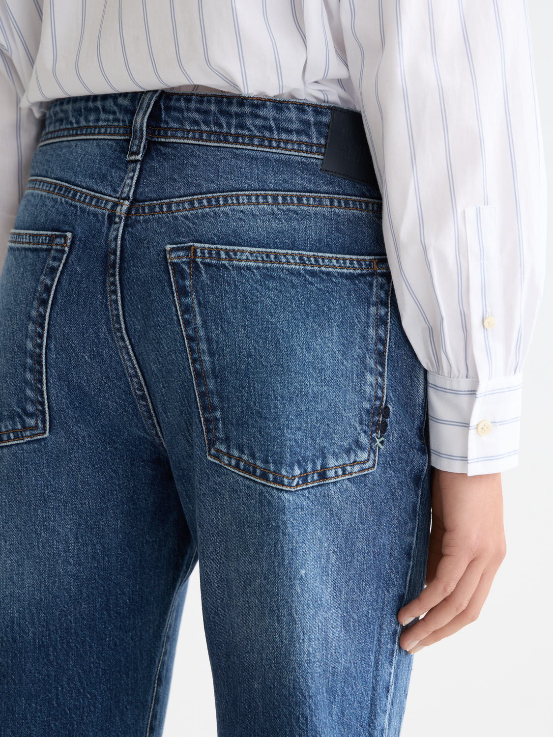 Scotch & Soda Buzz boyfriend-fit denim jeans displayed on a model, showcasing a relaxed, casual style with classic blue wash.