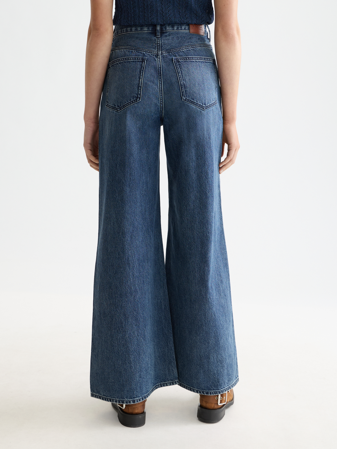 SCOTCH & SODA Wave wide-fit denim jeans with a relaxed fit and classic five-pocket style, shown in dark wash denim.