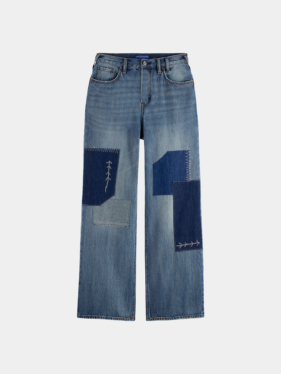 Deep loose-fit denim jeans by Scotch & Soda featuring a relaxed style and classic blue wash, shown on a model.