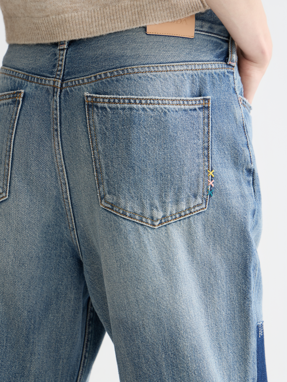 Deep loose-fit denim jeans from Scotch & Soda, shown on a model, featuring a relaxed silhouette and classic five-pocket design.