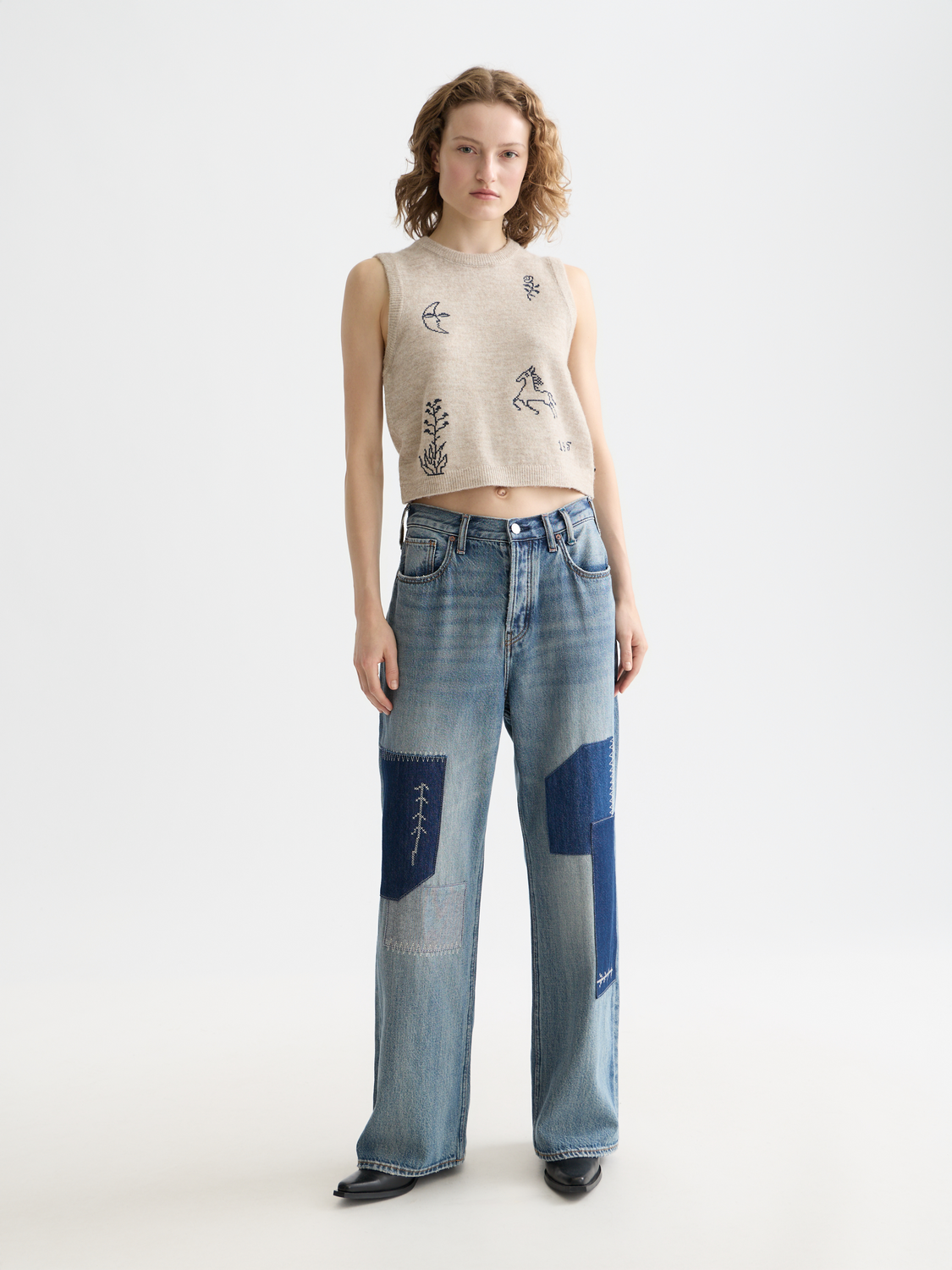 Deep loose-fit SCOTCH & SODA denim jeans with a relaxed style, shown from the front in this image.