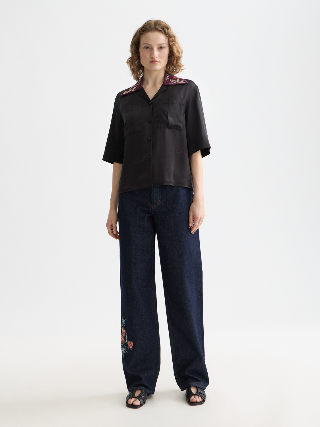 Pair of Scotch & Soda ripple straight-fit denim jeans displayed on a model, showcasing classic five-pocket design and light wash.