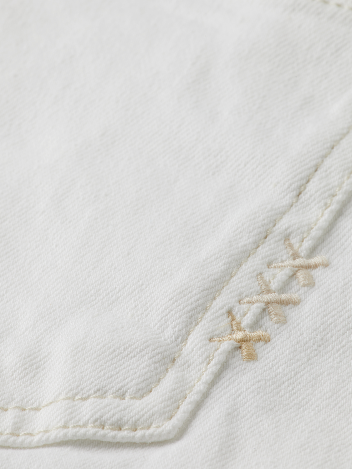 Sky straight-fit denim jeans by Scotch & Soda displayed on a hanger with a clean background.