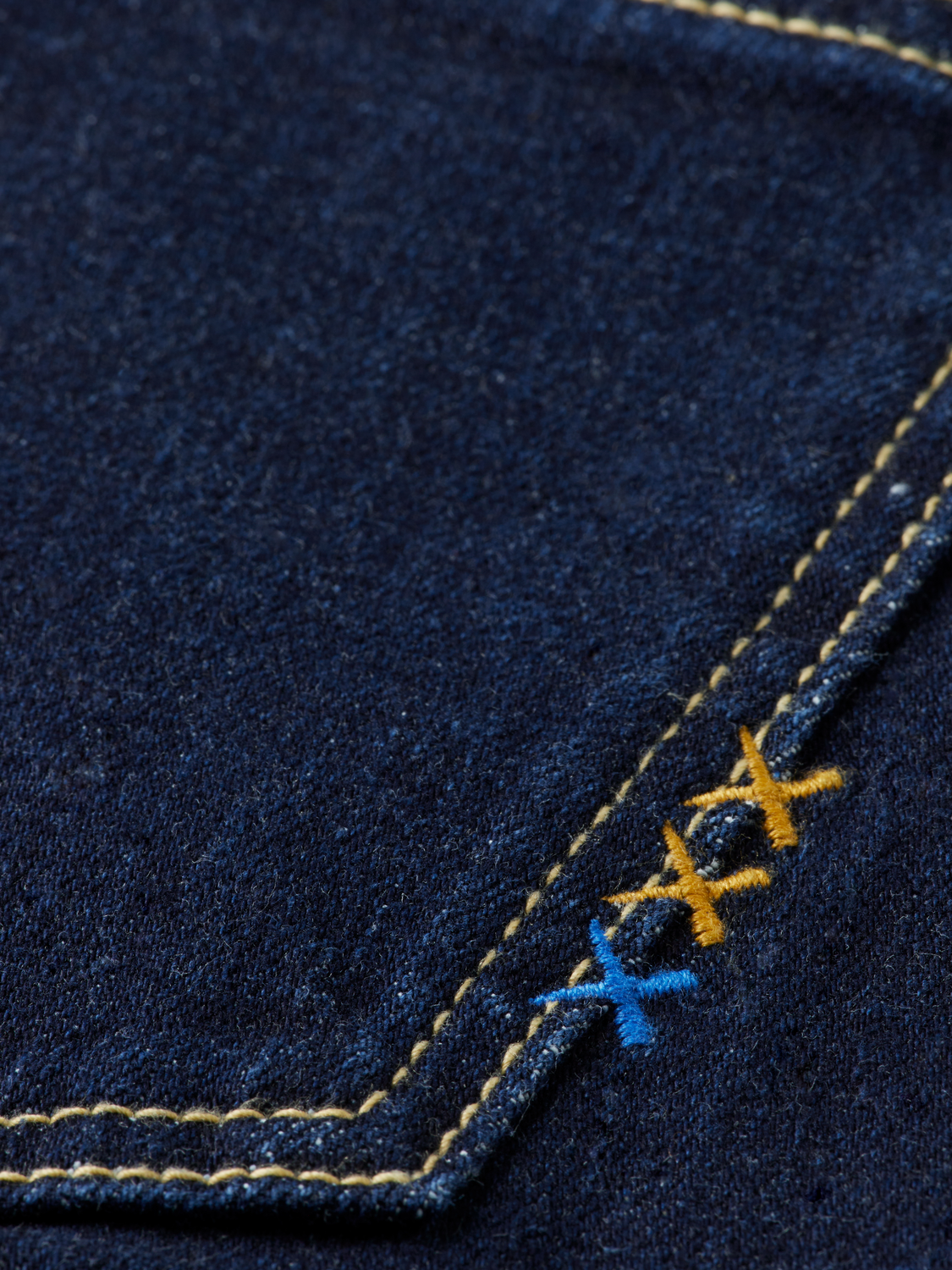 Sky straight-fit denim jeans by Scotch & Soda, shown on a hanger with a classic five-pocket design and faded blue wash.