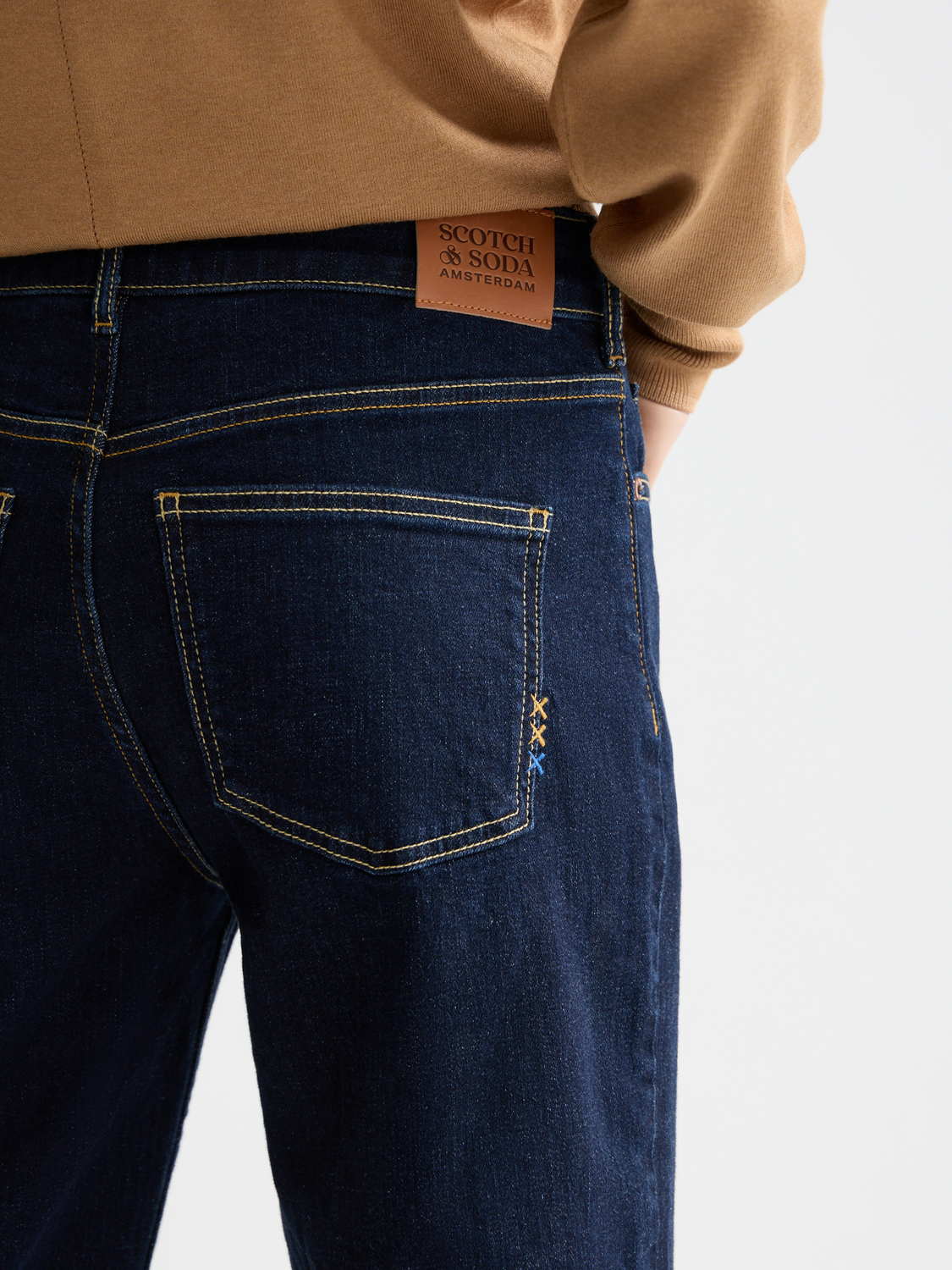 Sky straight-fit denim jeans by Scotch & Soda, shown in a light blue wash with classic five-pocket design and belt loops.